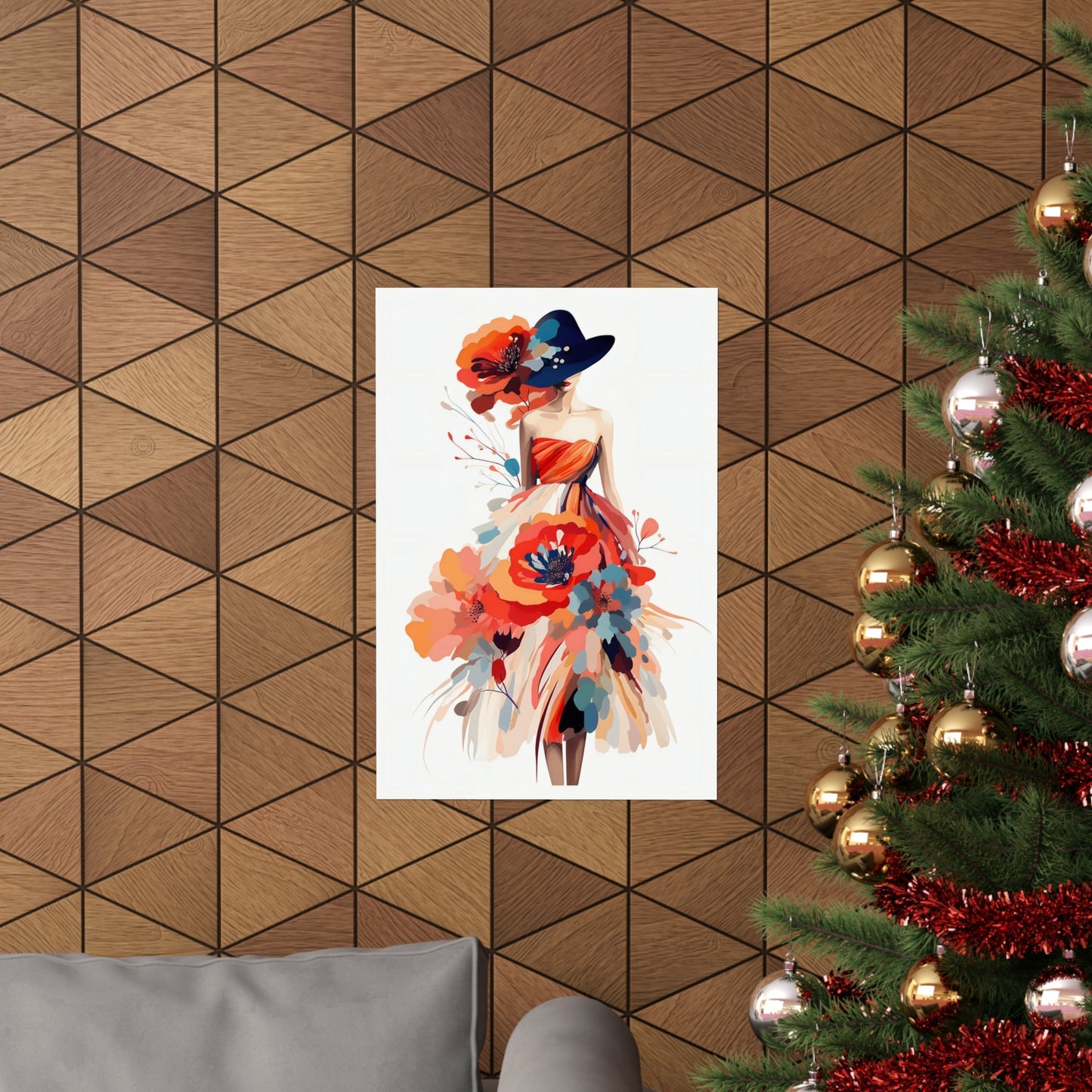 A christmas tree with a painting of a woman in a hat