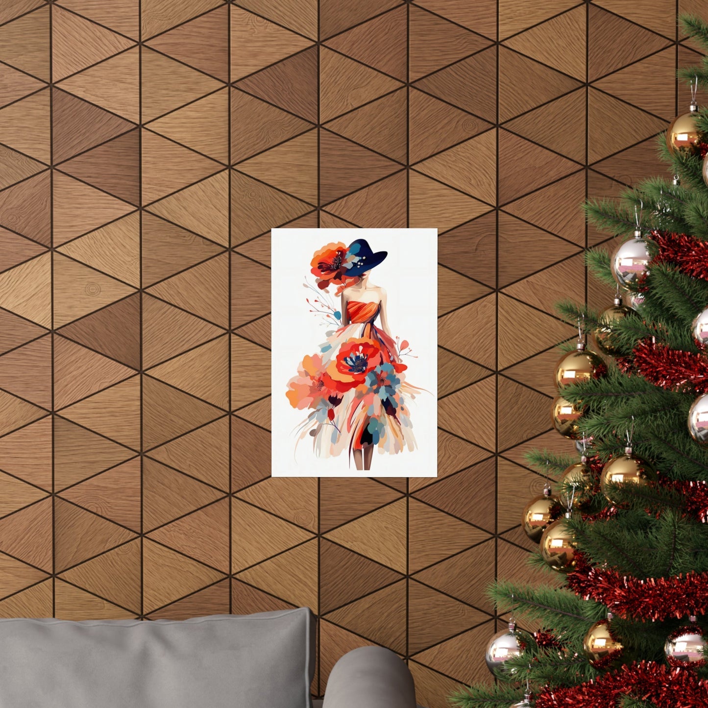 A christmas tree with a painting of a woman in a hat