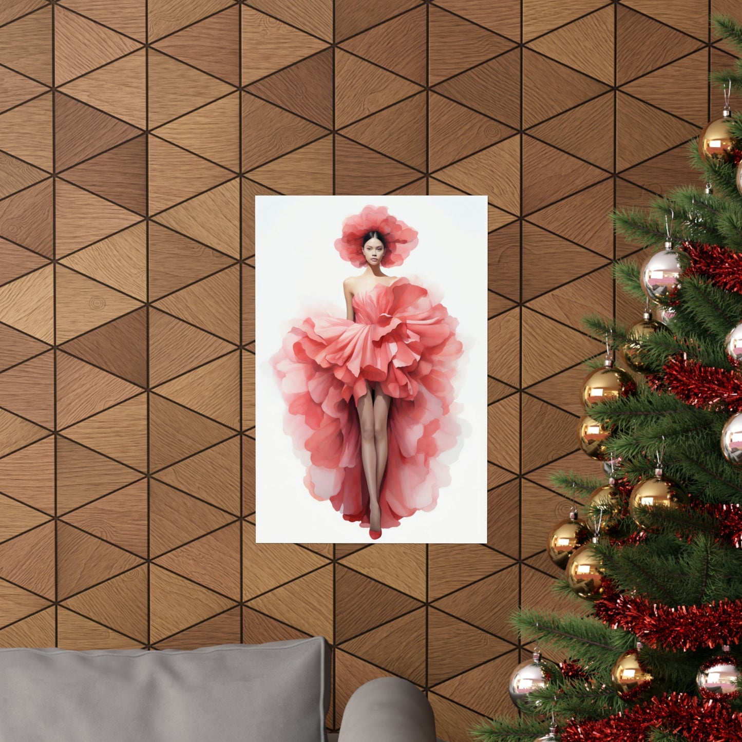 A christmas tree with a pink dress hanging on it