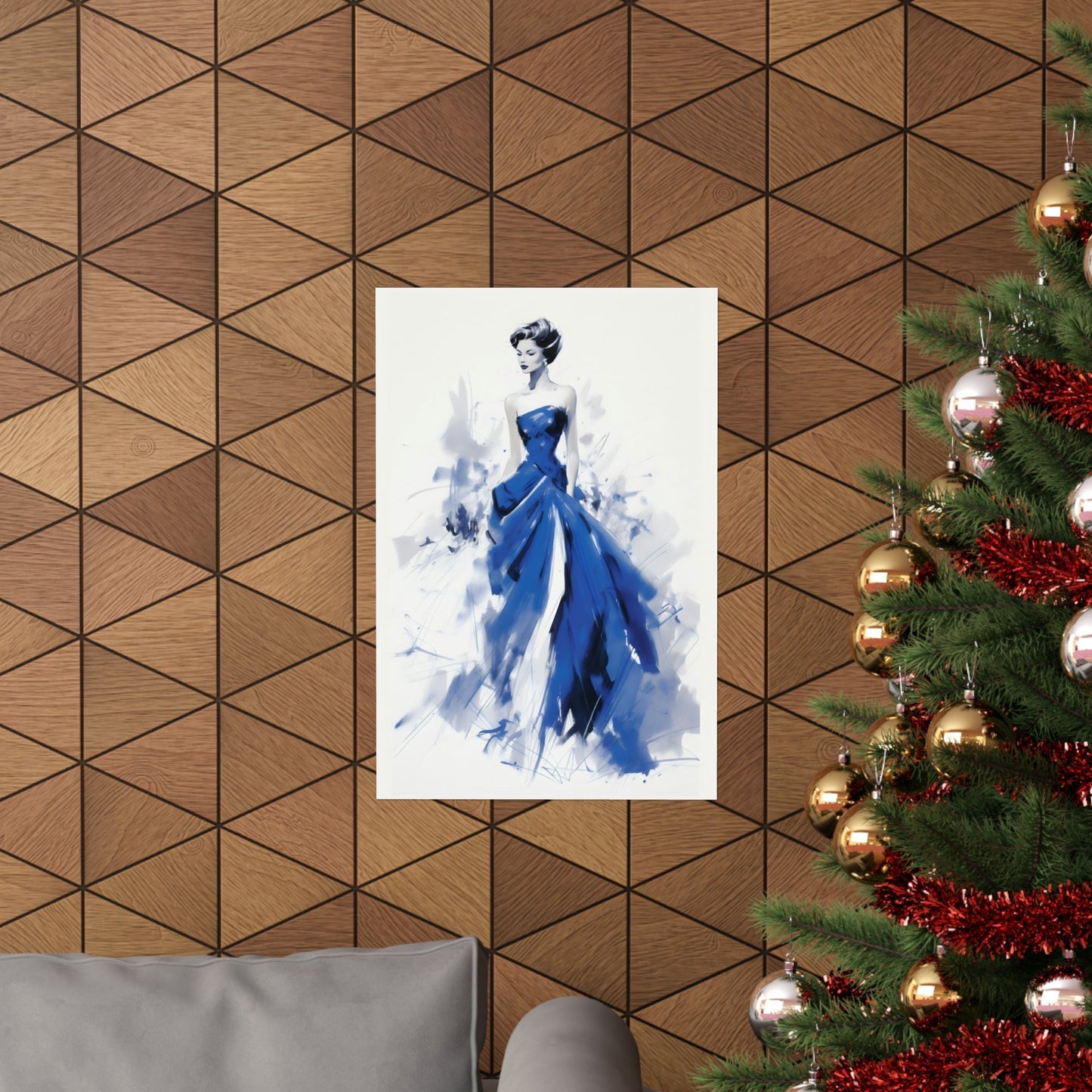 A christmas tree with a blue dress hanging on it