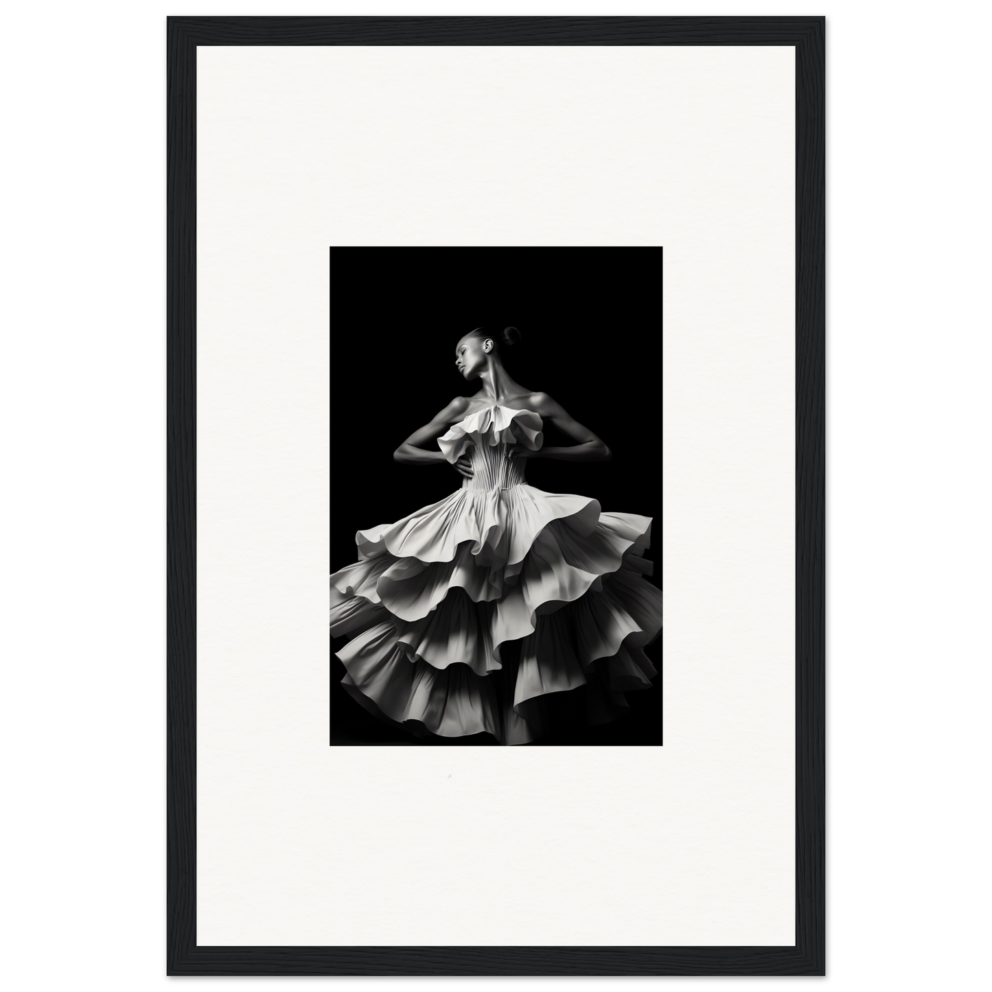 Black and white photograph of a dancer in a flowing, multi-layered dress.