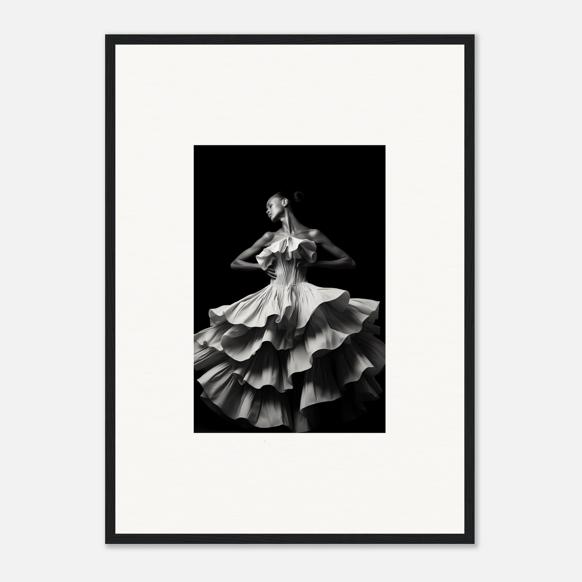 Black and white photograph of a dancer in a flowing, ruffled dress mid-twirl.