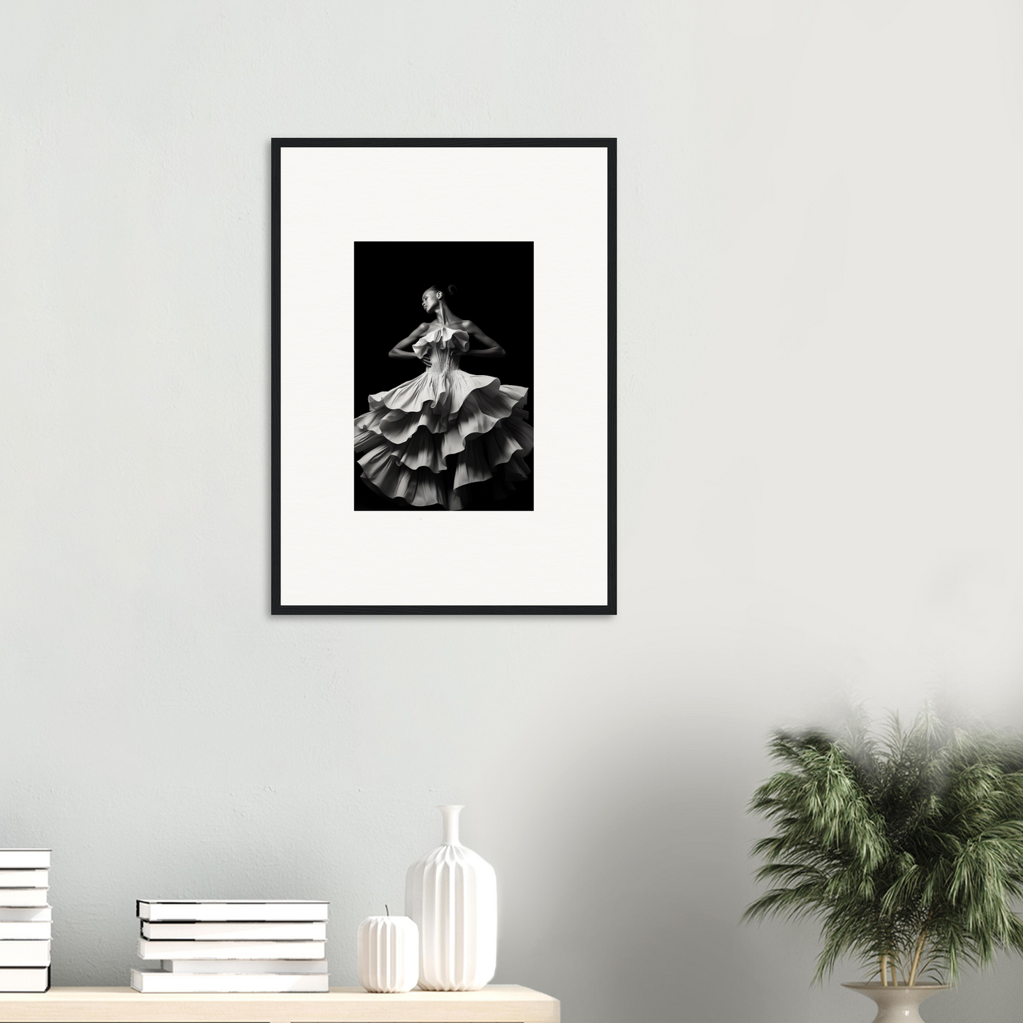 Framed black and white photograph of a flamenco dancer in a ruffled dress.
