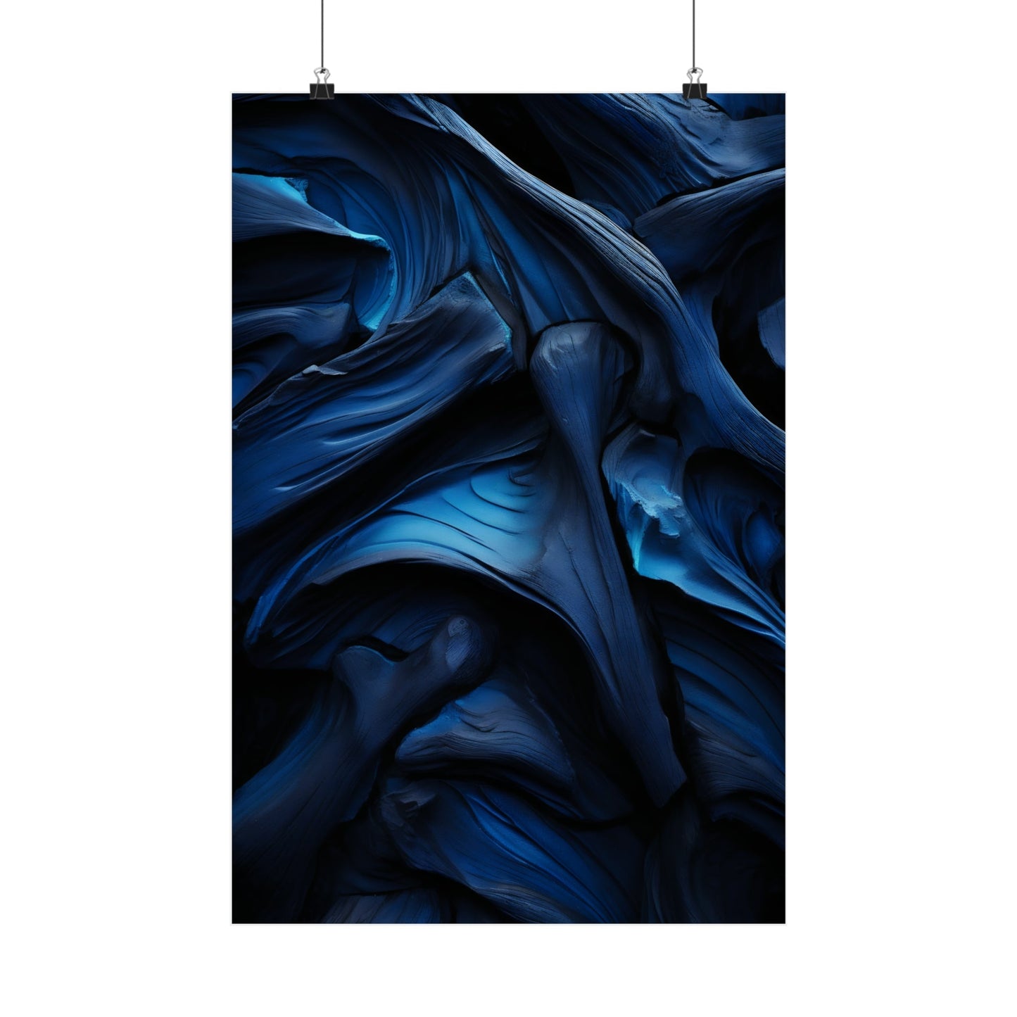 Abstract swirling pattern of deep blue and black tones resembling flowing fabric or liquid.