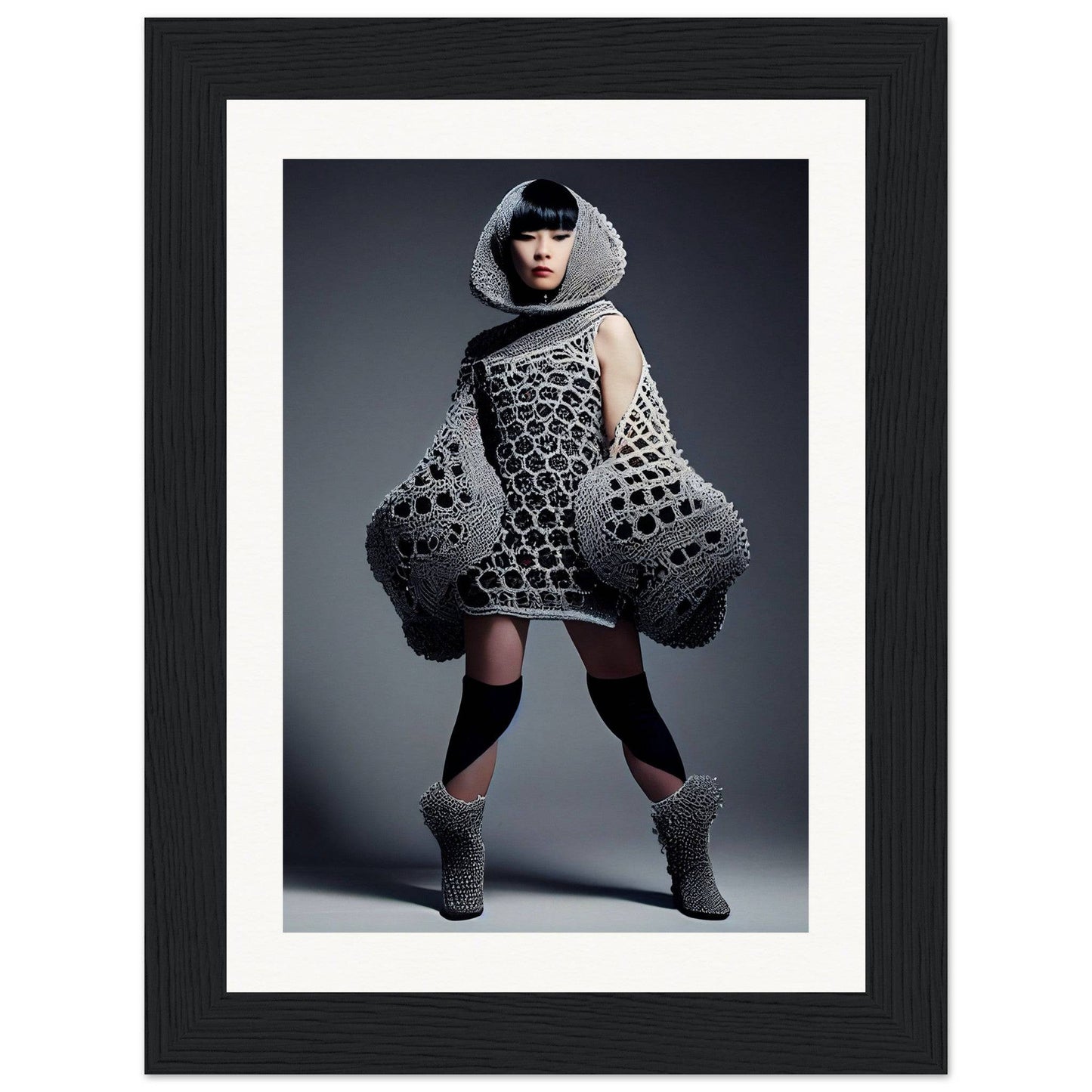 Avant-garde knitted dress with exaggerated voluminous sleeves and geometric patterns.
