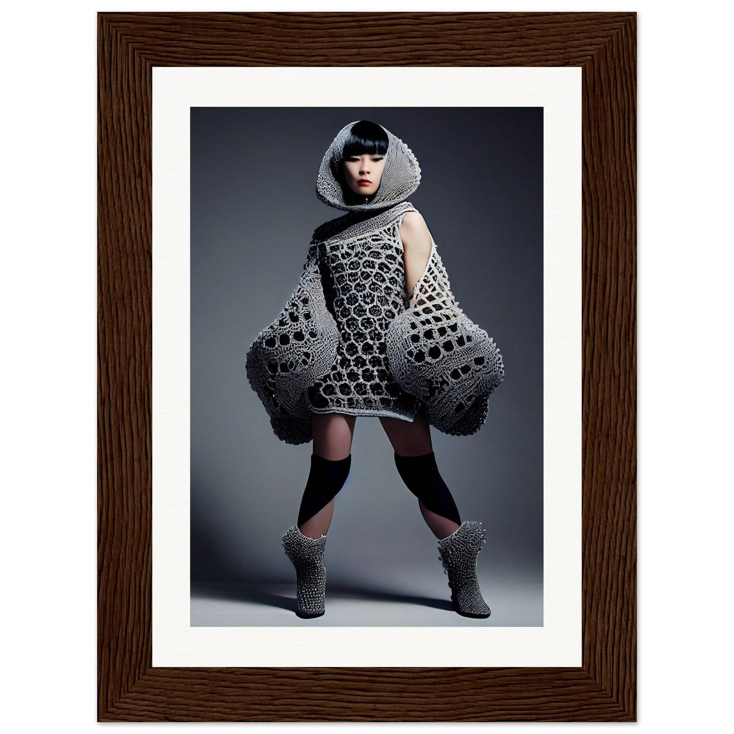 Avant-garde knitted dress with exaggerated voluminous sleeves and a geometric pattern.