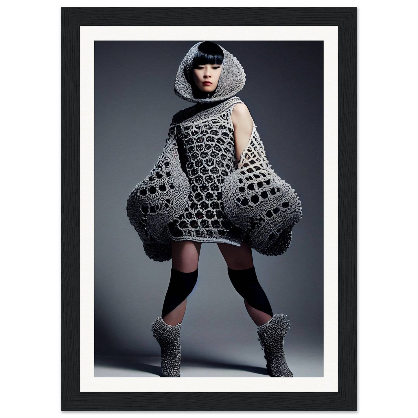 Avant-garde fashion outfit featuring a honeycomb-patterned dress with exaggerated hip structures and matching hooded accessories.