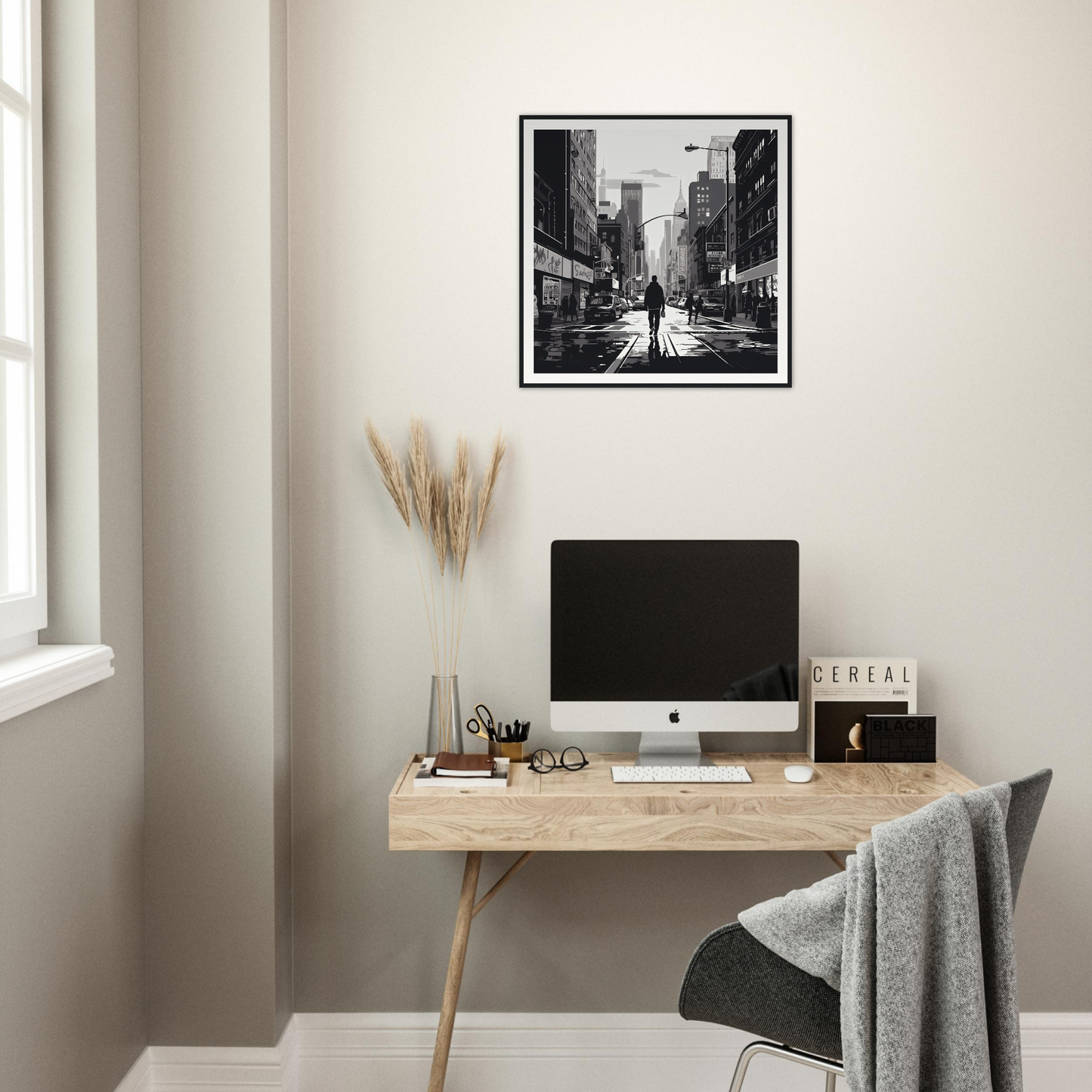 Minimalist wooden desk with iMac and Solitude Charms Silhouettes artwork above