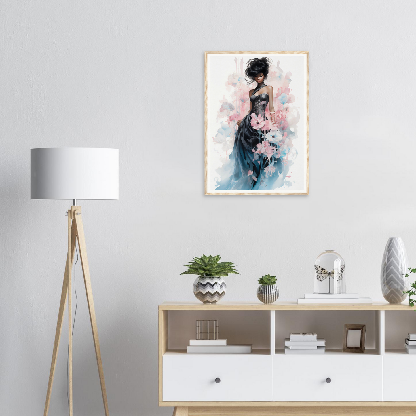Framed watercolor painting of an elegant woman in a flowing blue dress with pink floral accents.
