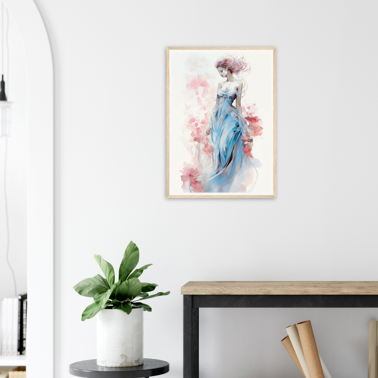 Framed watercolor painting of an elegant figure in a flowing blue dress against a soft pink background.