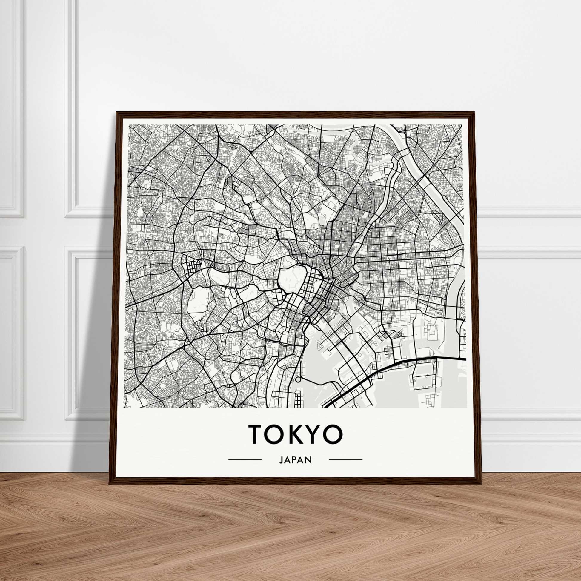Framed map of Tokyo, Japan showing the city’s street layout and districts in black and white.