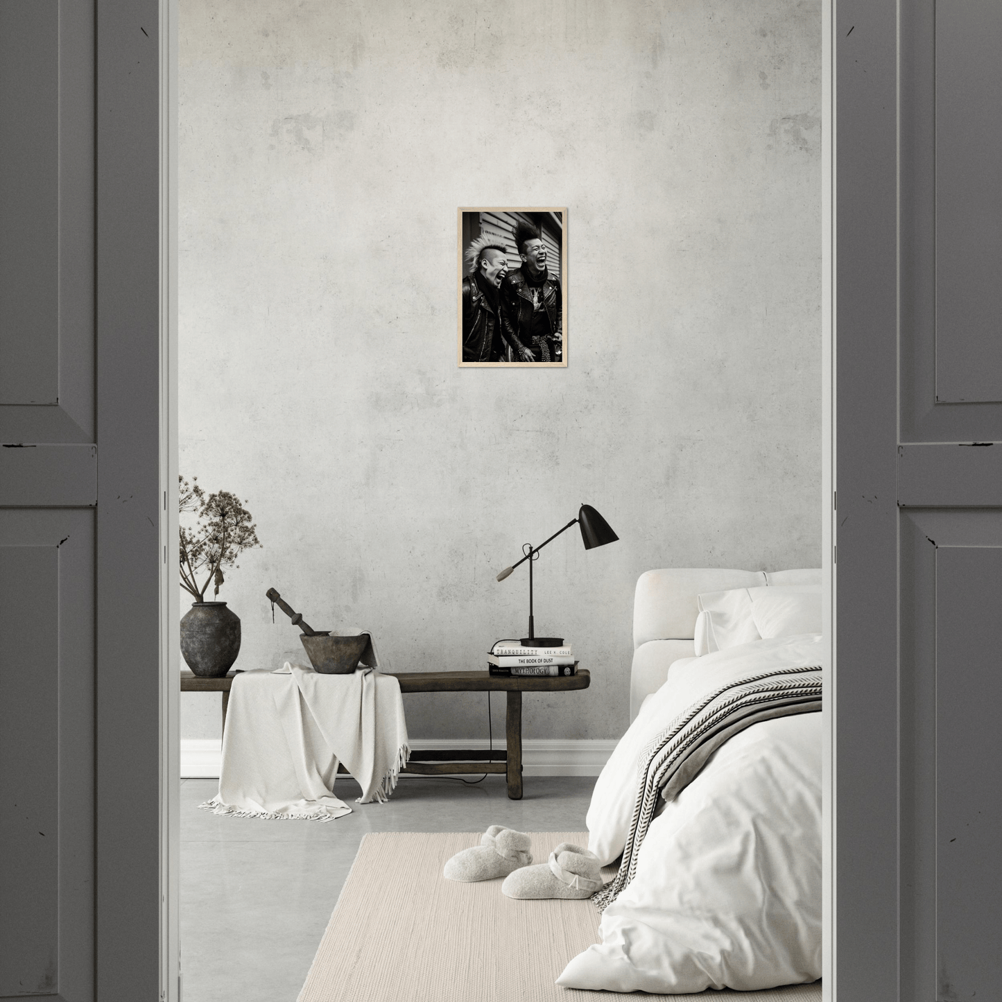 Minimalist bedroom with neutral color palette and sparse decor.