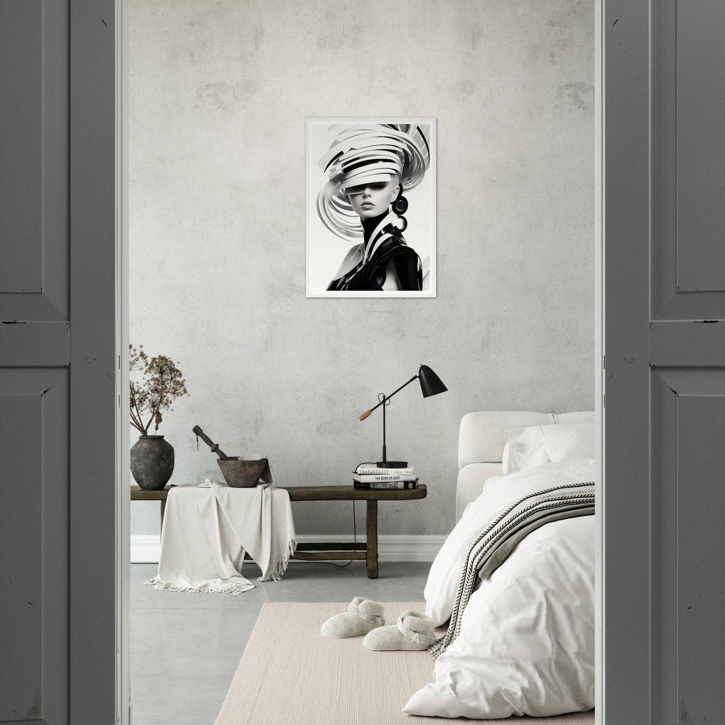 Monochromatic bedroom with minimalist decor and a striking black-and-white portrait on the wall.