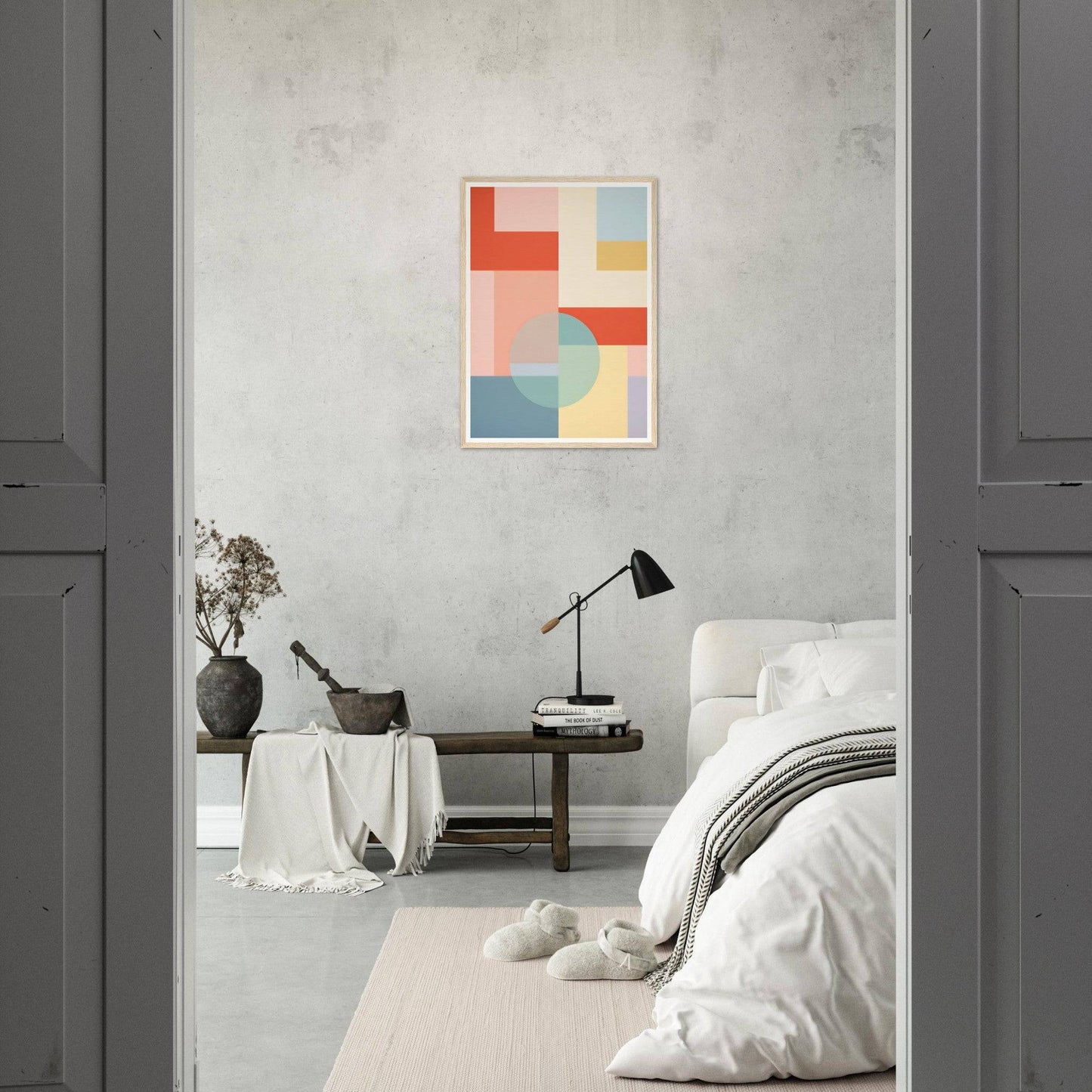 Minimalist bedroom with a colorful geometric artwork on the wall.