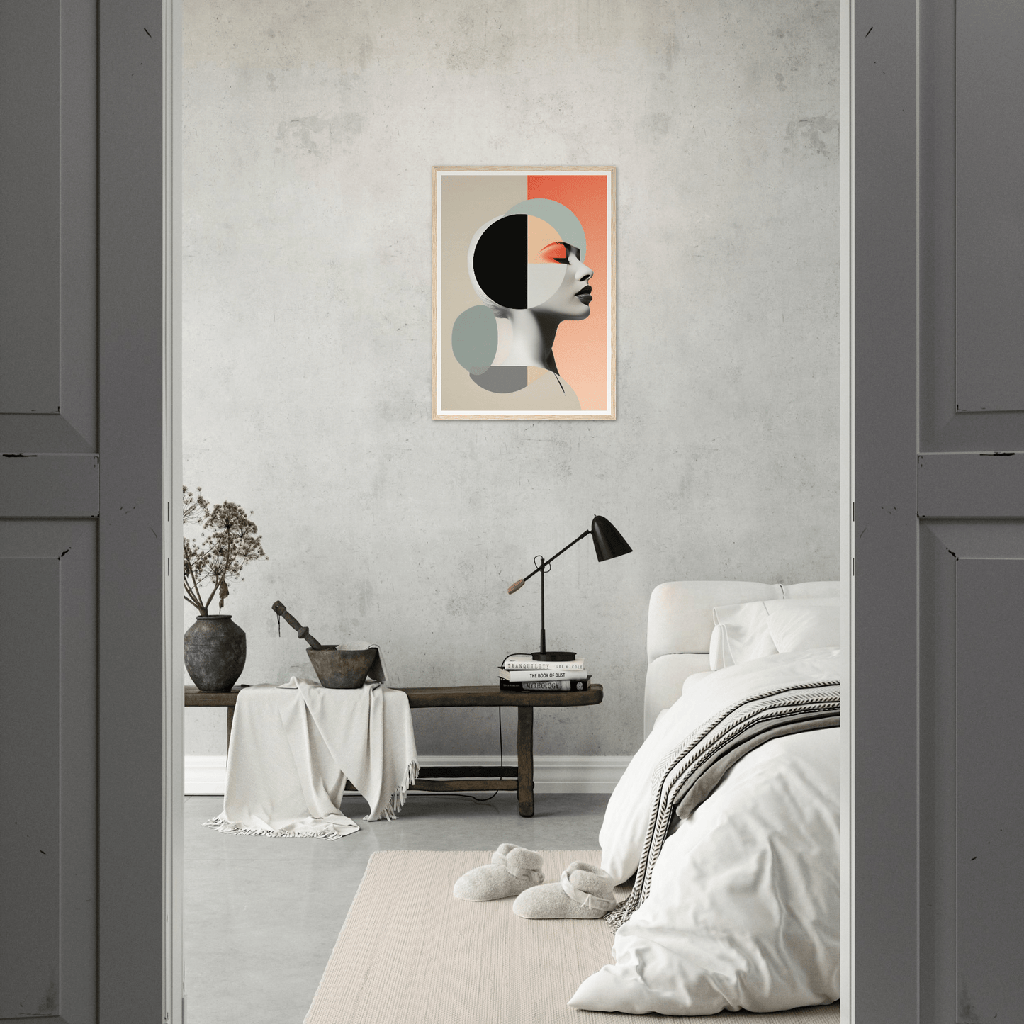 Minimalist bedroom with a striking abstract portrait on the wall.