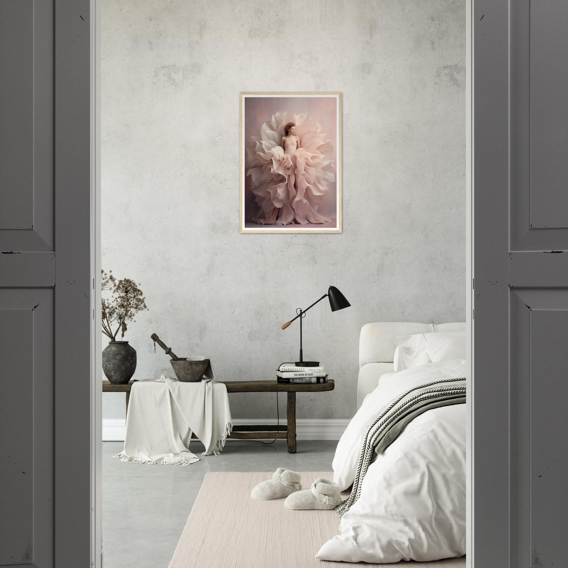 Framed artwork of a figure in flowing fabric hanging on a wall.