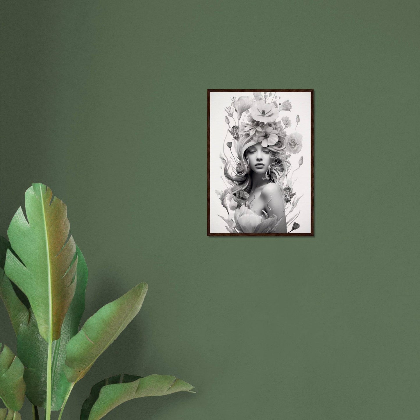 Framed black and white portrait of a woman with floral elements in her hair.