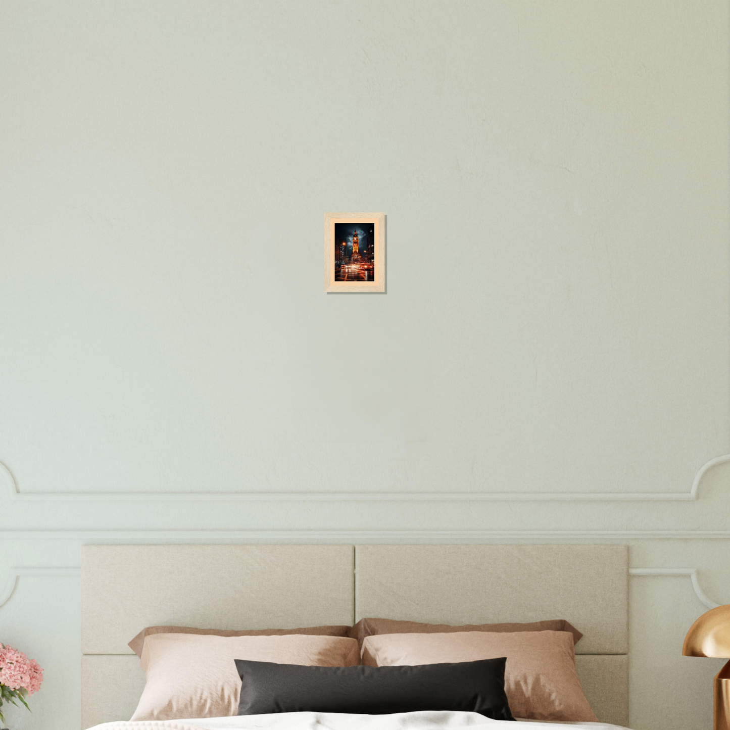 Bedroom with a small framed picture above the headboard.