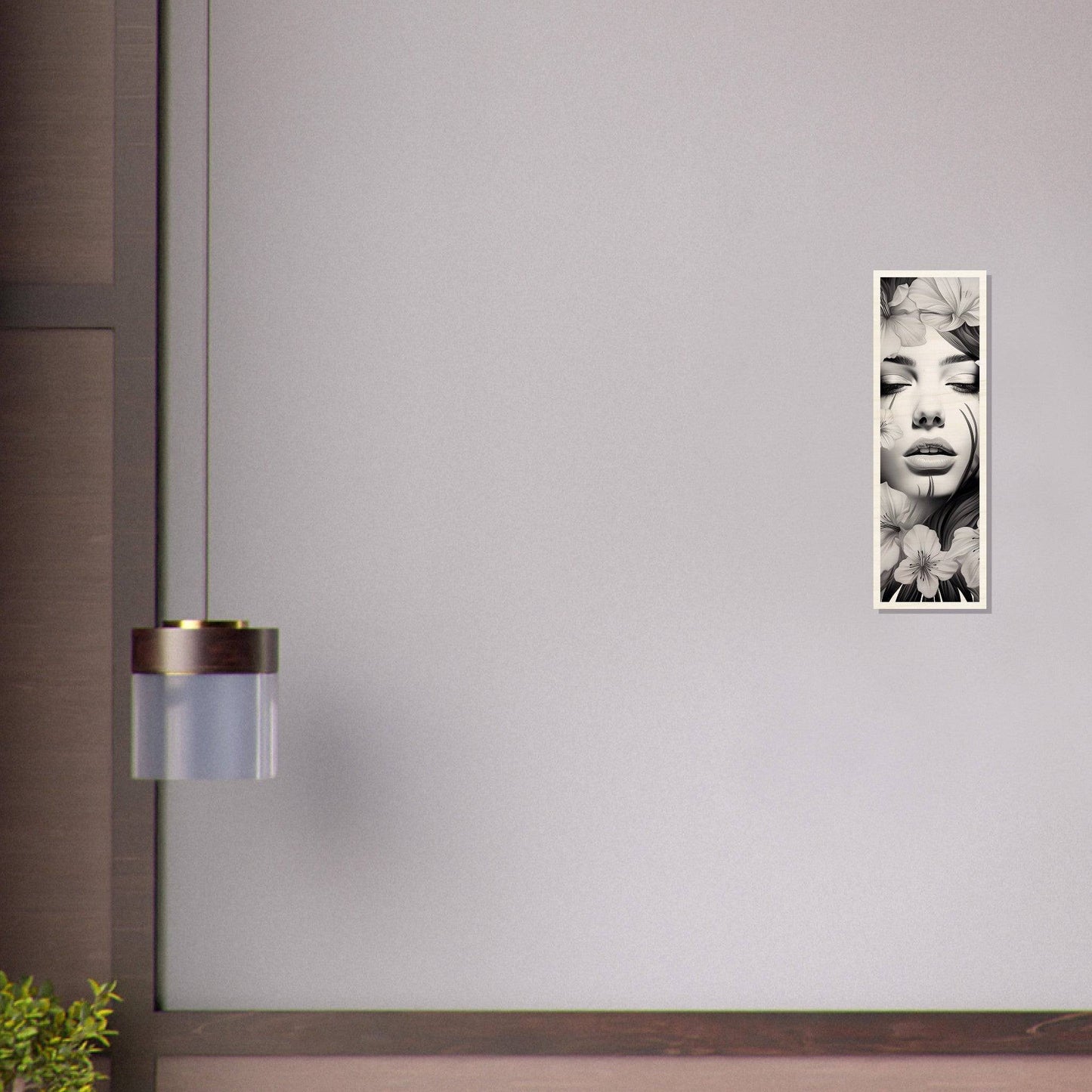 Black and white portrait photograph hanging on a wall.