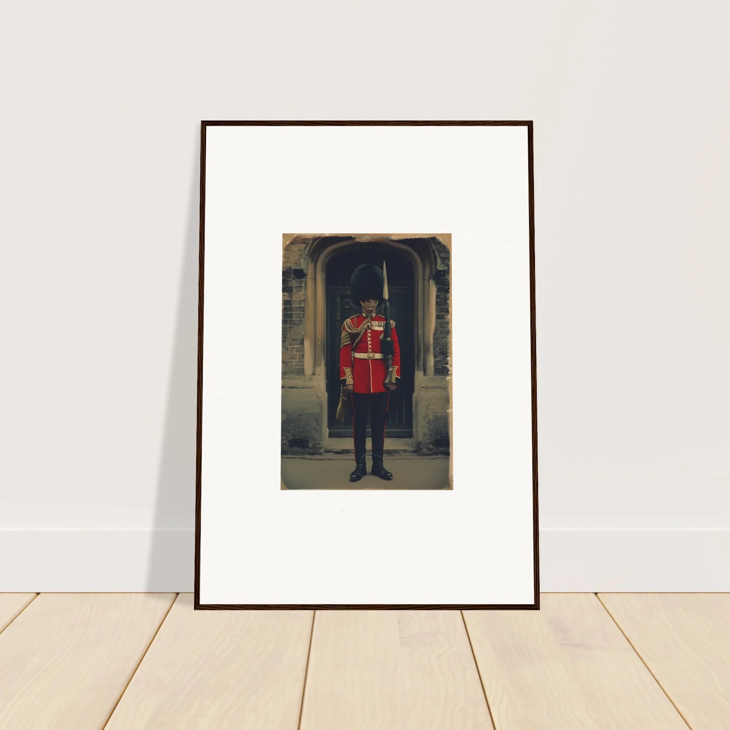 Framed art of a Queen’s Guard in red uniform at Solstice Brickbeard Visitor