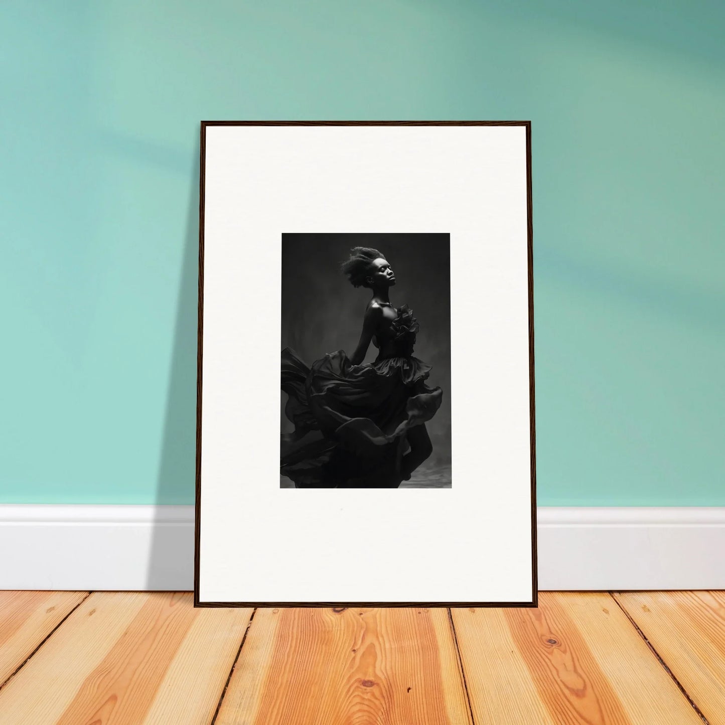 Framed black and white photo of Veiled Nigretto Whispers leaning against a wall