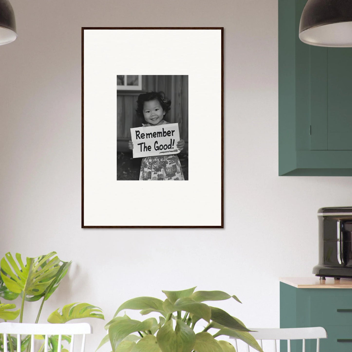 Framed black and white photo of someone holding a sign Remember The Good in Essence Savor Whispers