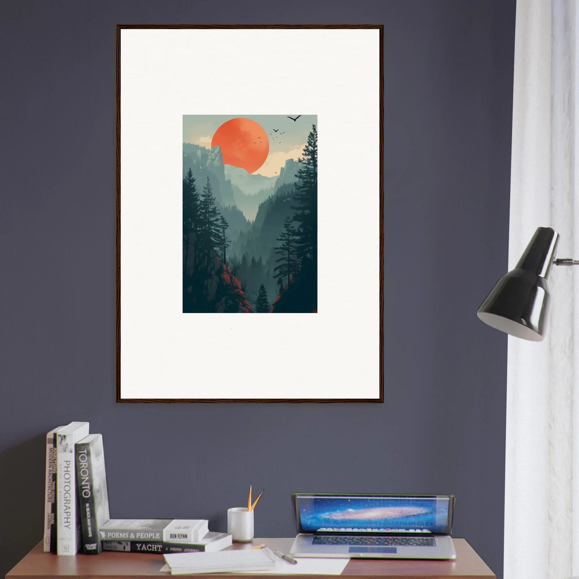Framed wall art of a forest with a big orange sun, perfect for room decoration