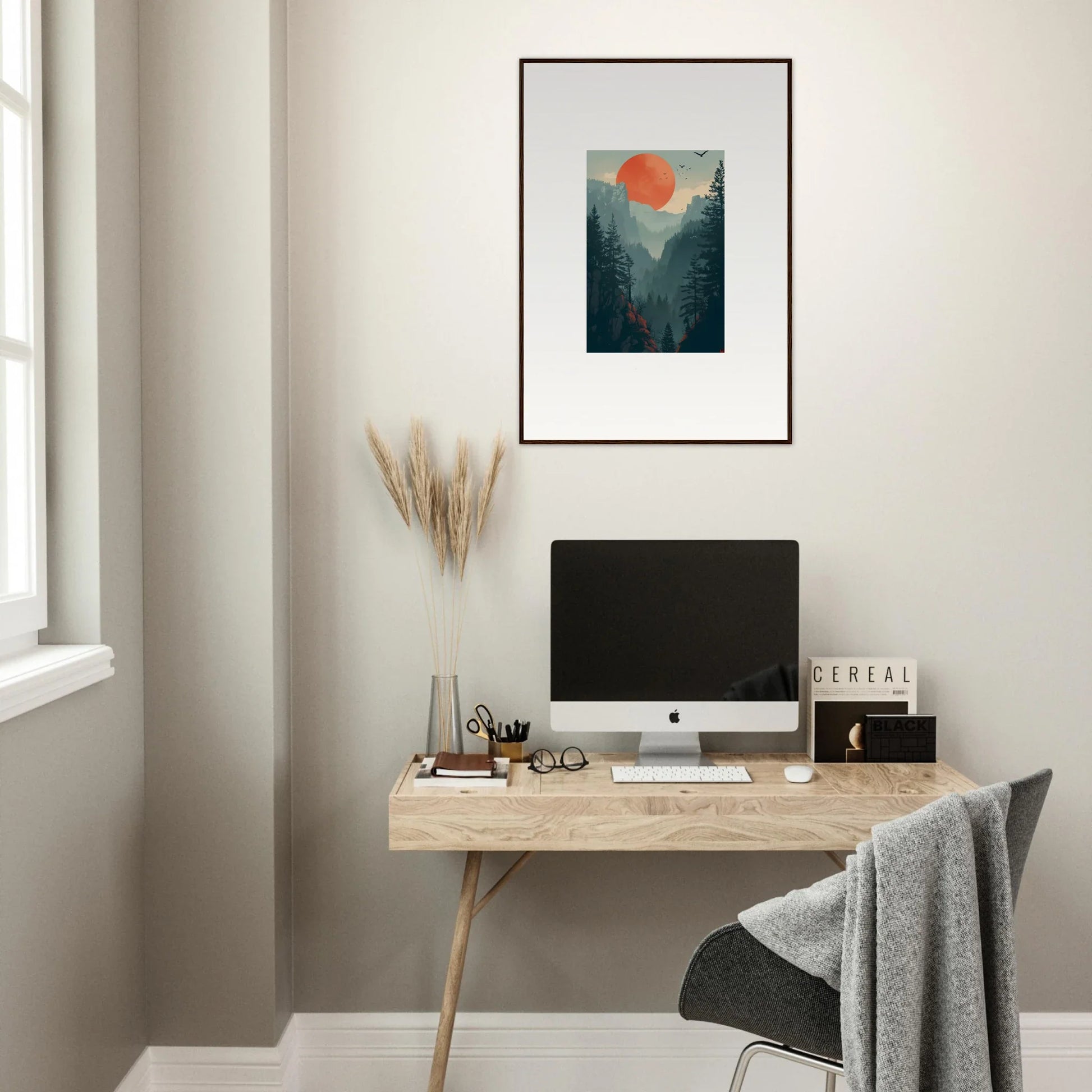 Minimalist home office with wooden desk, computer, and Sunset Wilderness wall art