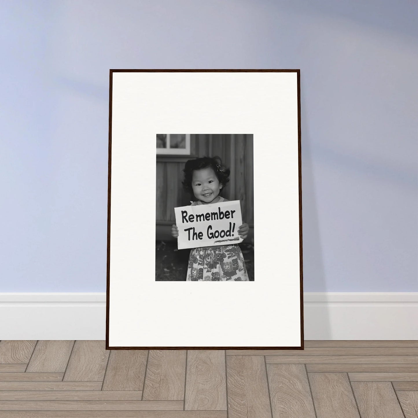 Framed black and white photo of a kid with a Remember The Good sign for Essence Savor Whispers