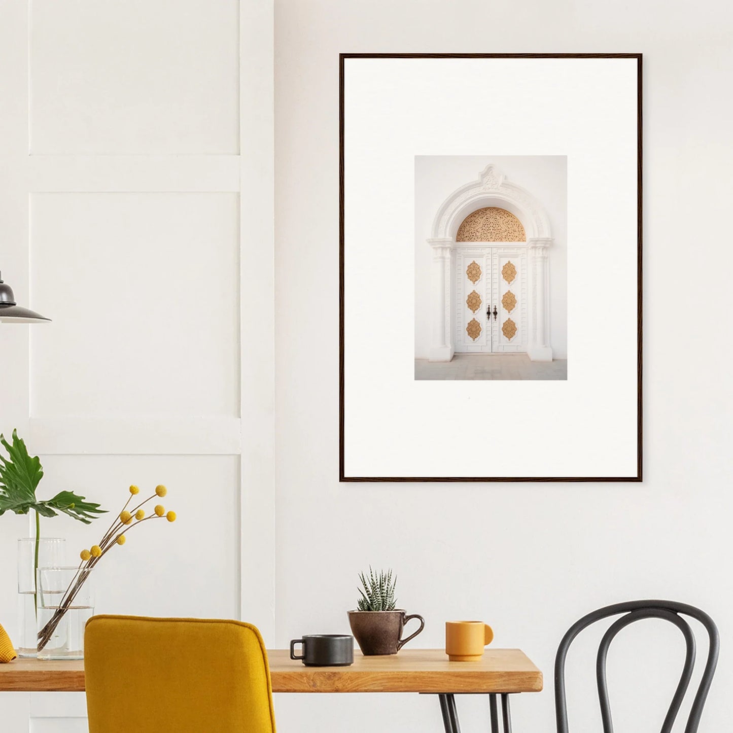 Framed wall art of a white arched doorway with gilded medallions in Gilded Mirage Passage