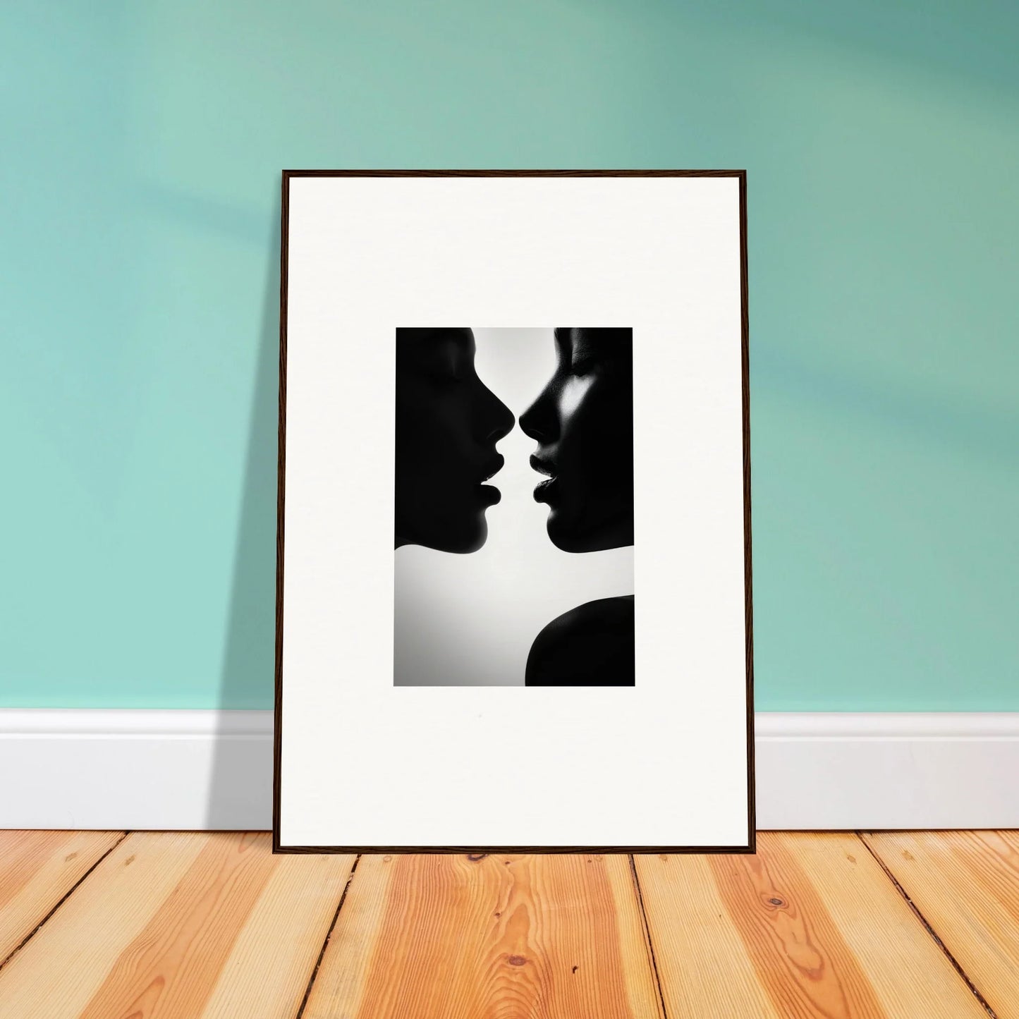 Framed black and white silhouette art of two profiles for Sables Dance special edition