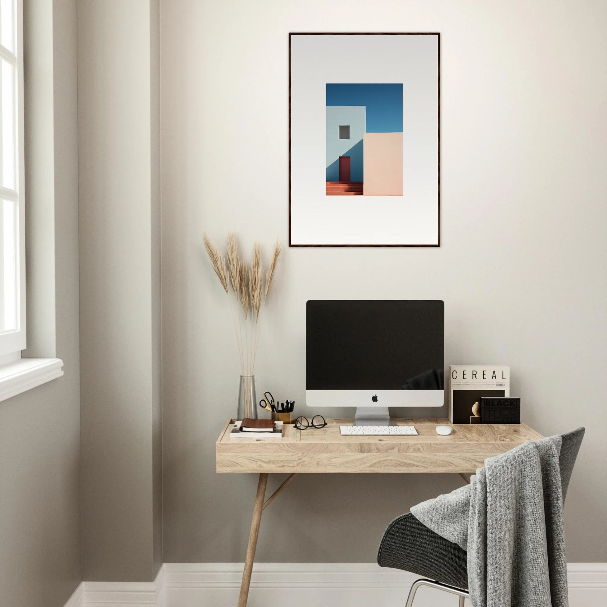 Minimalist wooden desk with iMac display featuring Tangents of Porcelain special edition art