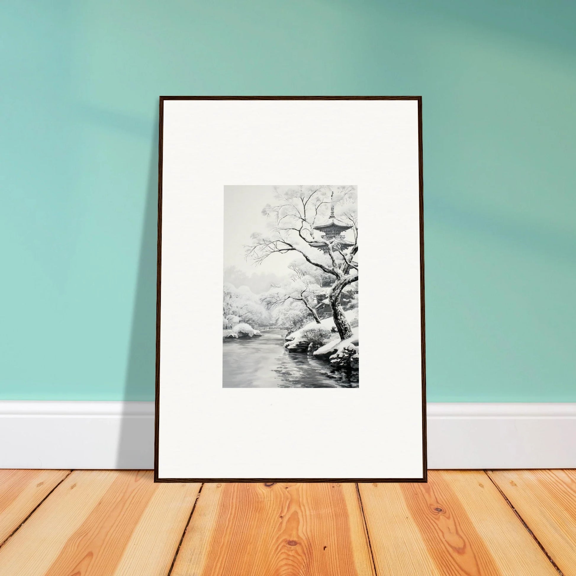 Framed black and white artwork of a tree by water in Metaphysical Winter Reverie