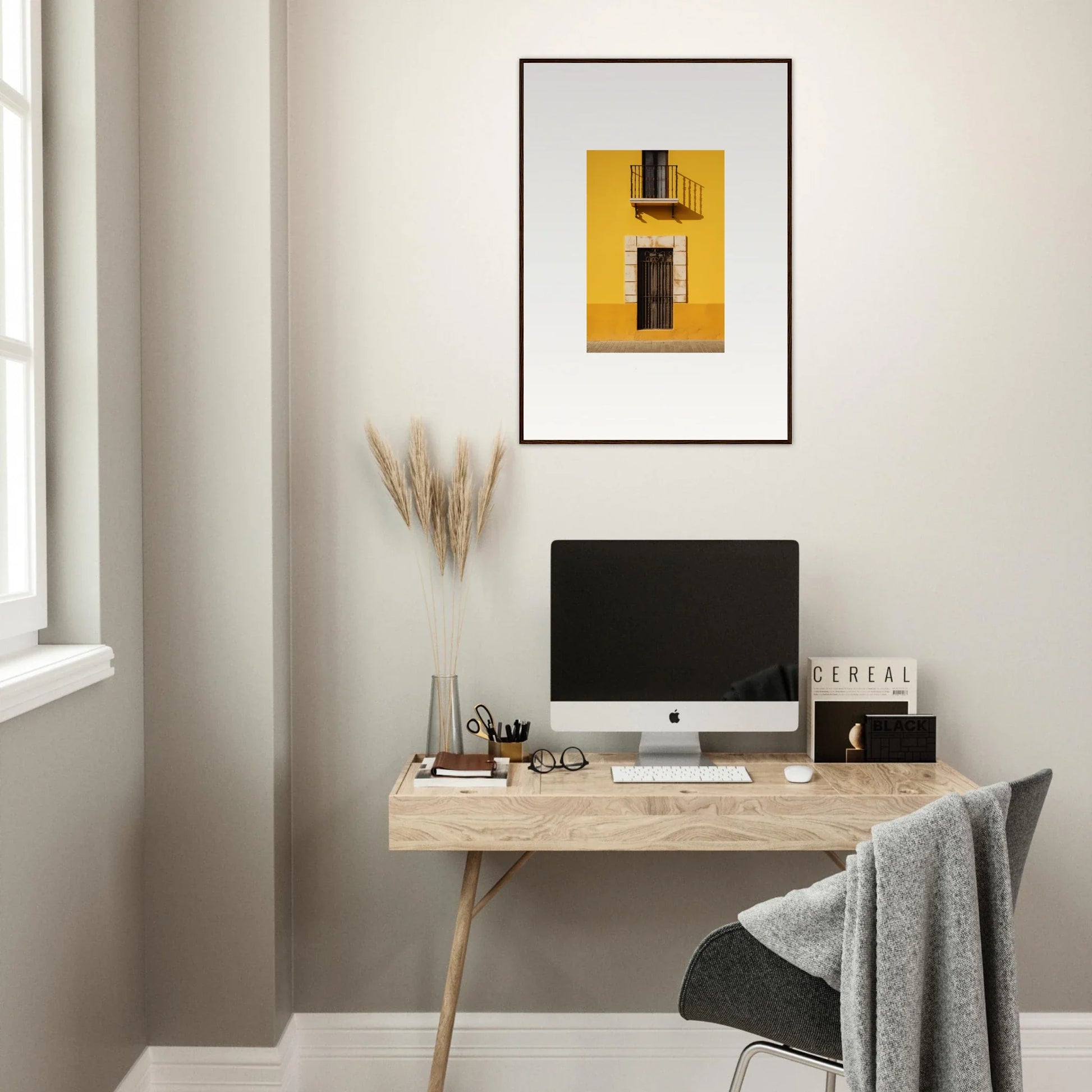 Minimalist wooden desk with iMac and Sun Custard Symphonies special edition art™ above
