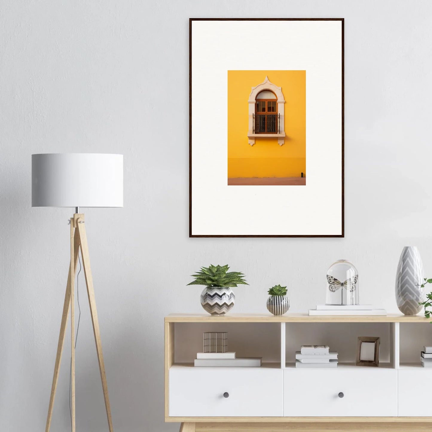 Framed art of a yellow wall with an arched window in Golden Portal Reverie