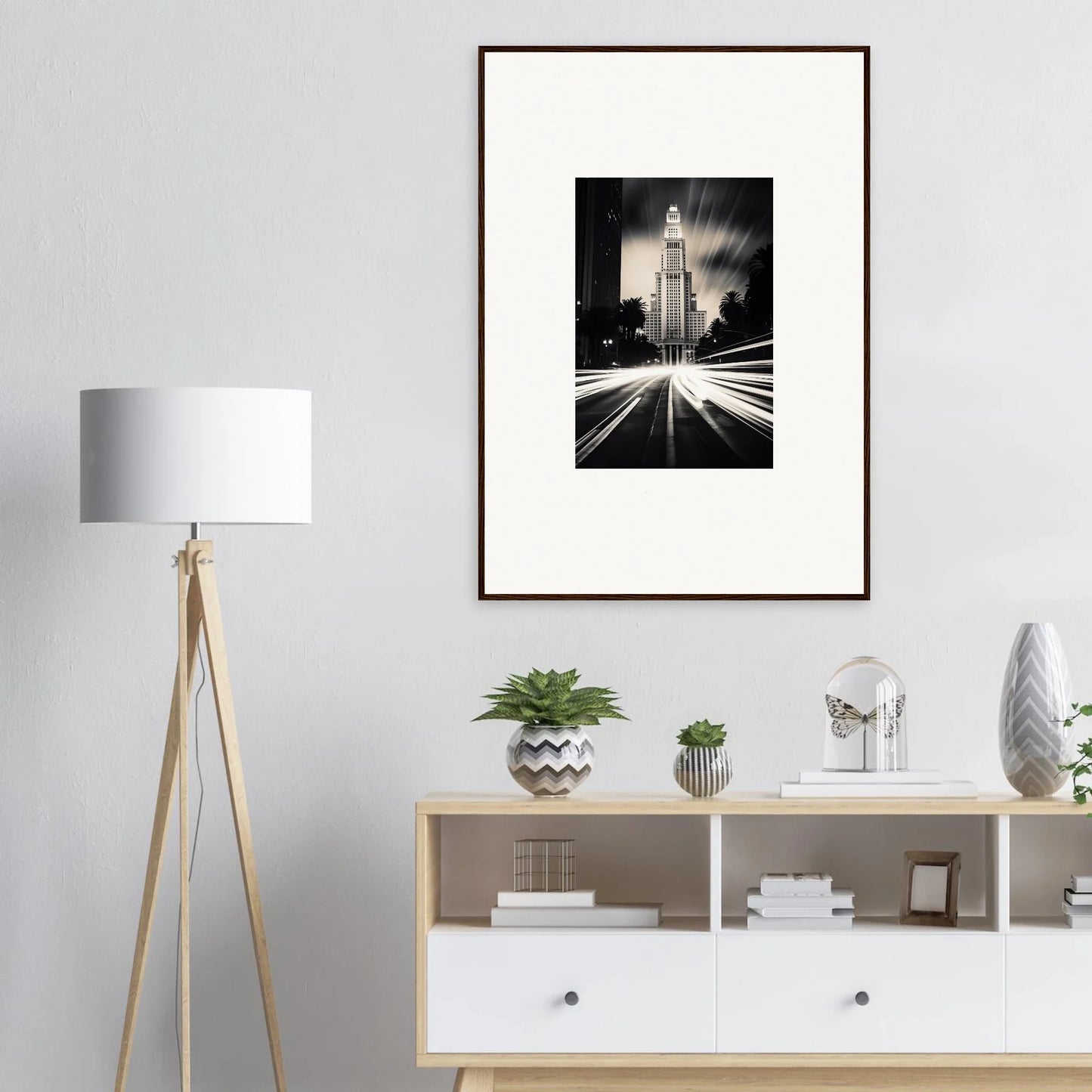 Modern room decor with Luminescent Metropolis Beacon framed poster above stylish storage unit
