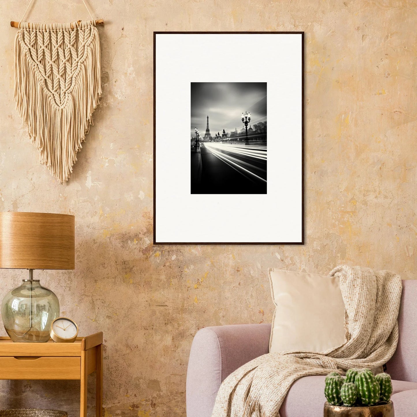Black and white framed wall art of a city street with light trails and Eiffel Tower