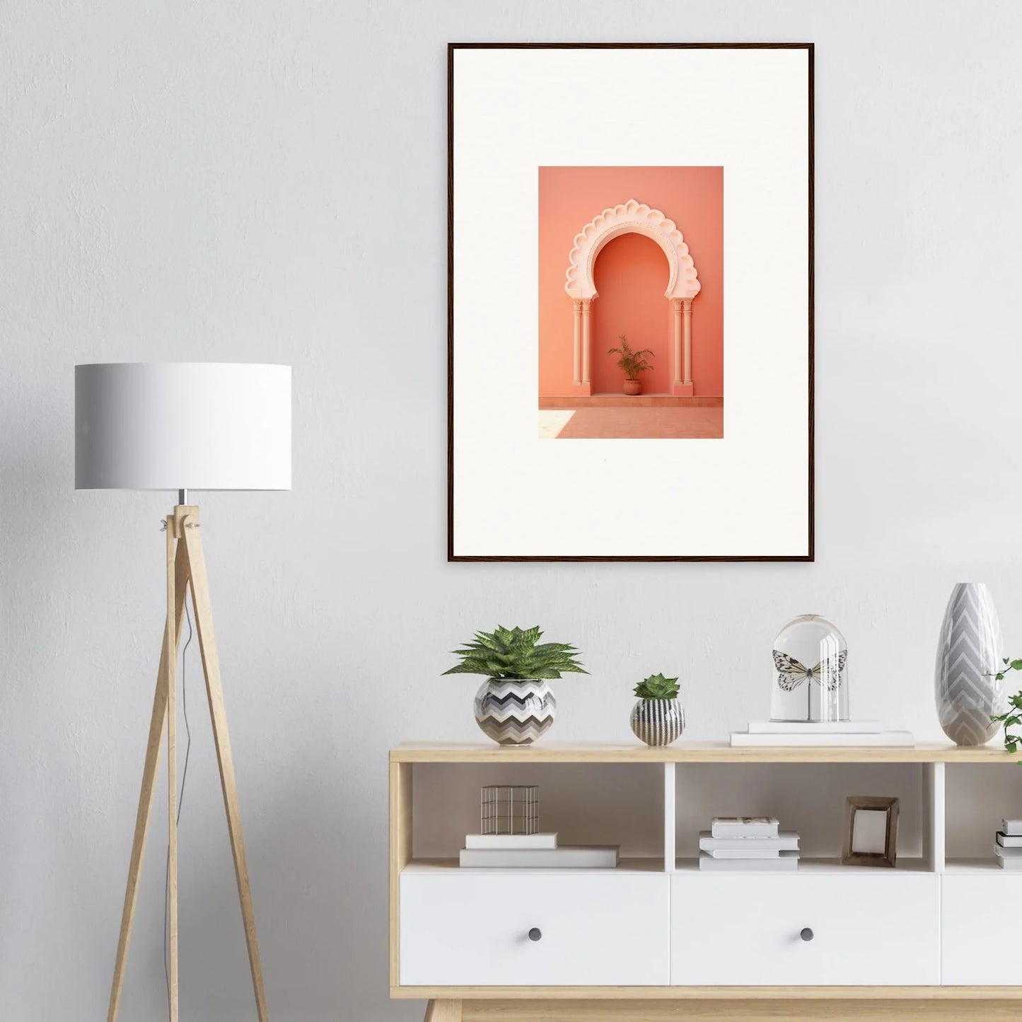 Framed wall art of a coral arched doorway in the Narco Échappatoire Portal design