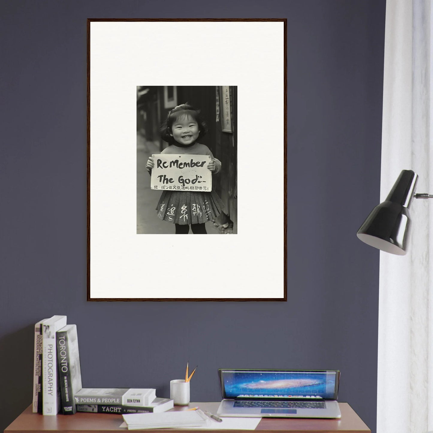 Framed black and white photo of a child with a sign from Sacred Smile Echoes
