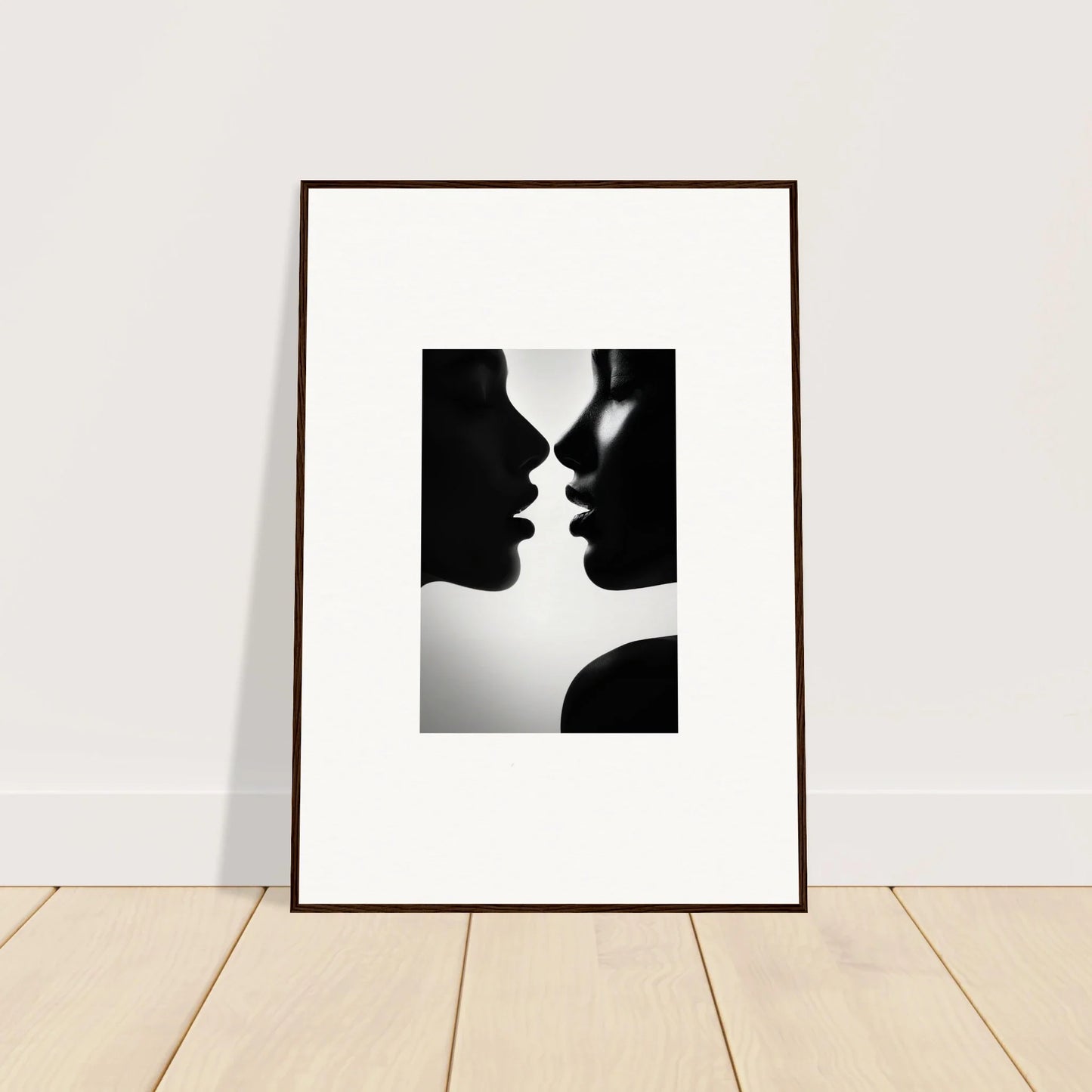 Framed black and white photo of two silhouettes kissing from Sables Dance special edition art™