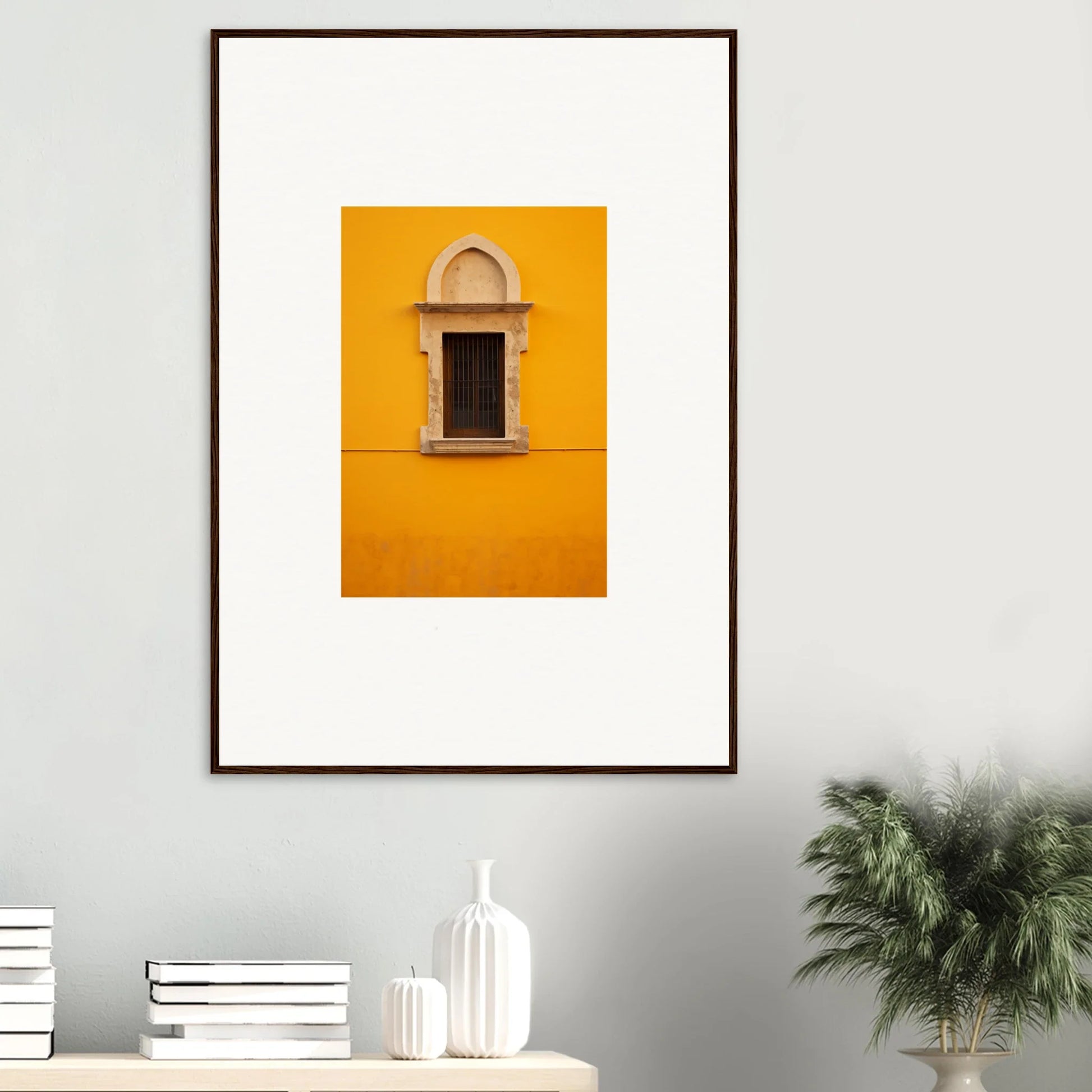 Framed wall art of an arched window on a yellow wall from Golden Correspondence Portal