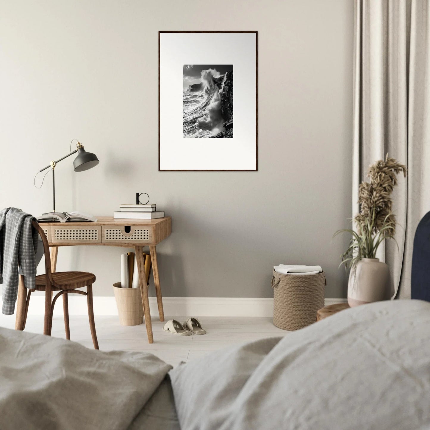 Wooden desk with a lamp and Tidal Curved Reality framed wall art above it