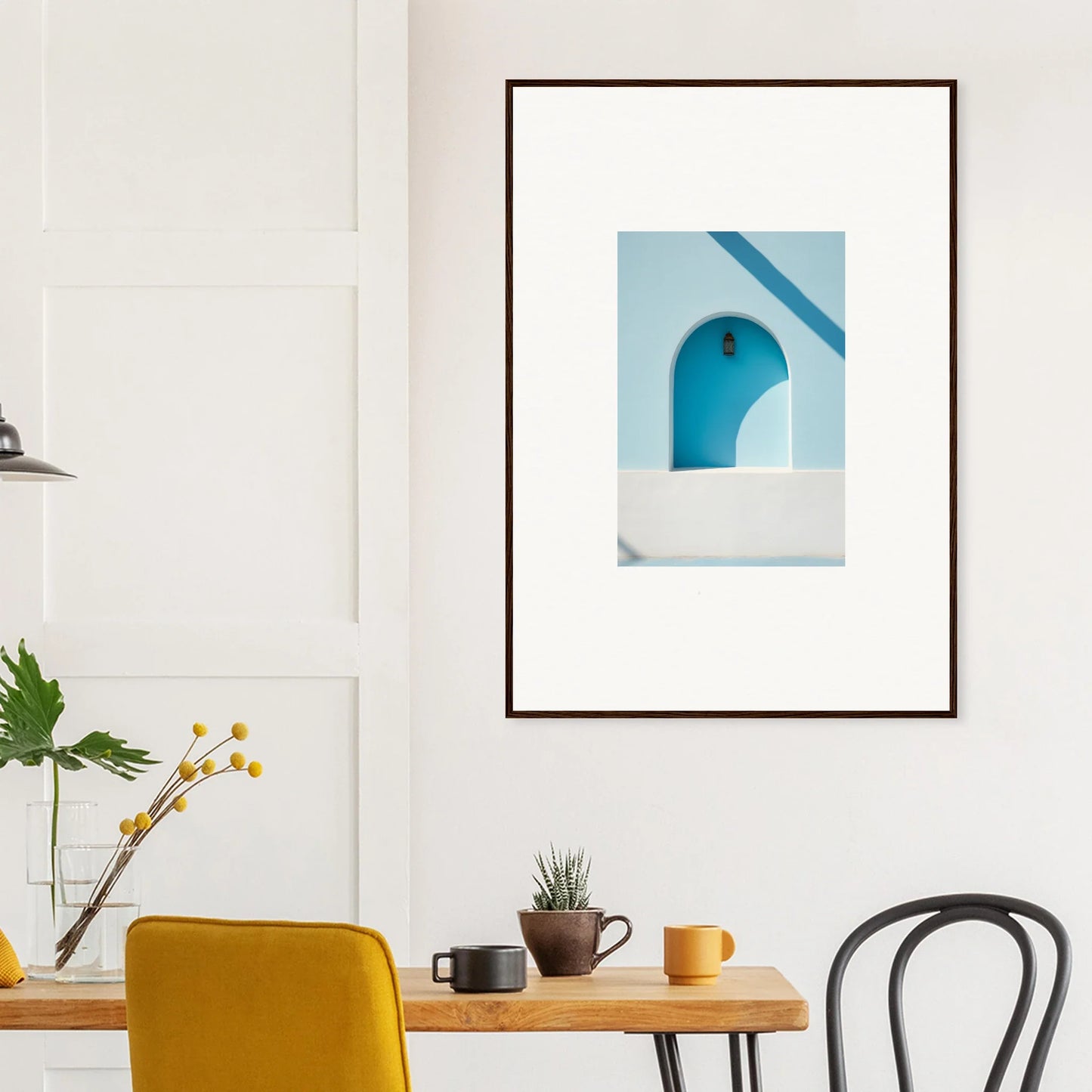 Framed wall art of a minimalist Mediterranean archway in white and turquoise blue