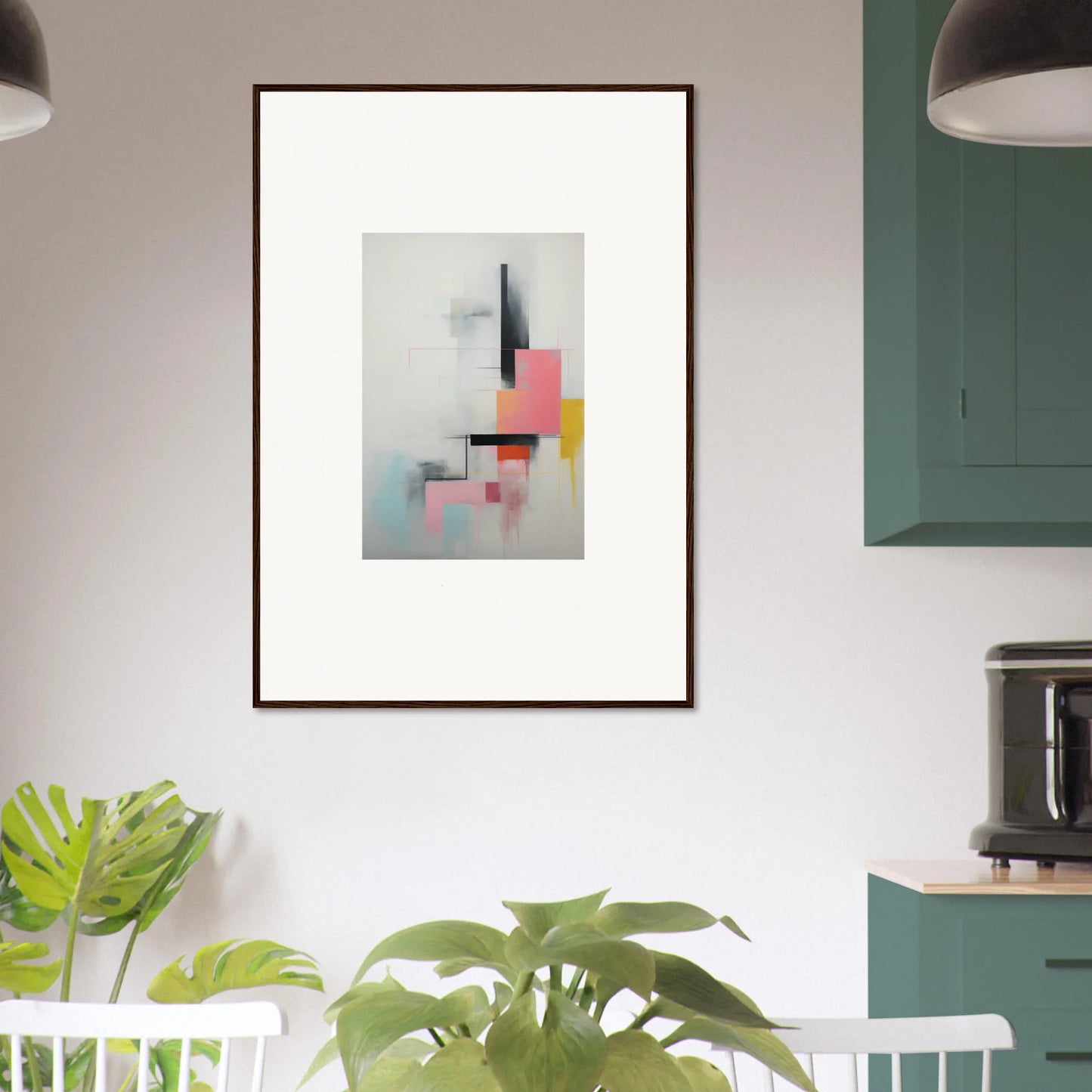 Framed wall art with geometric shapes in pink, yellow, black, and pale blue tones