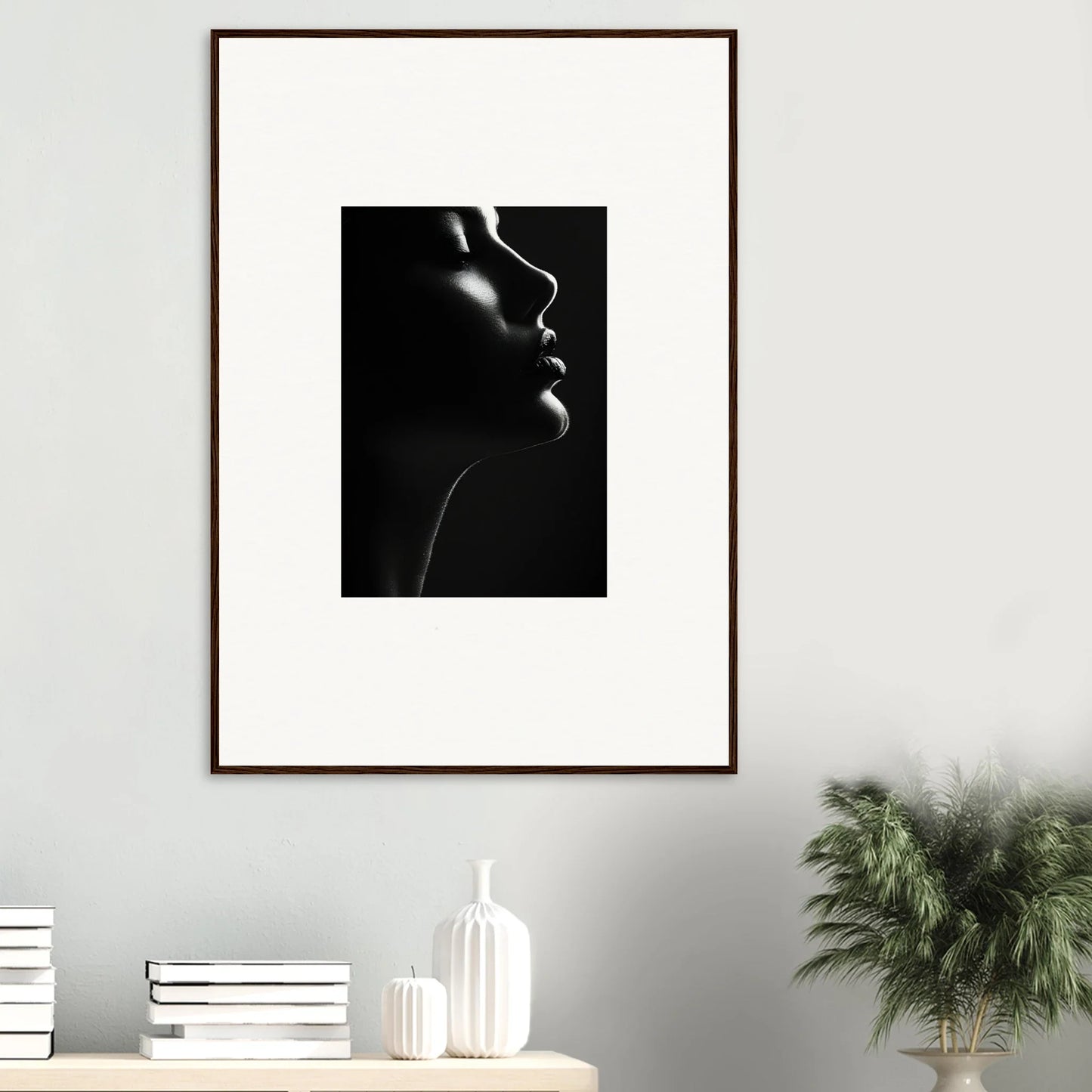 Dramatic black and white profile portrait in a brown frame from Yin Space Reverie