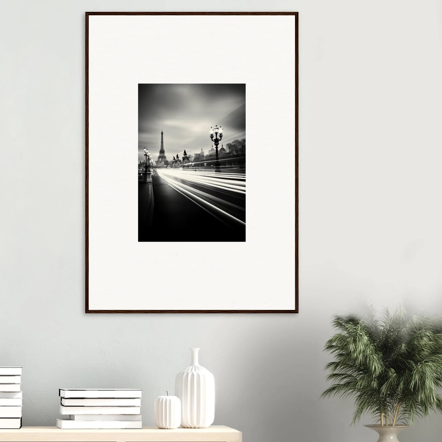 Framed wall art featuring a black and white Eiffel Tower photo with light trails