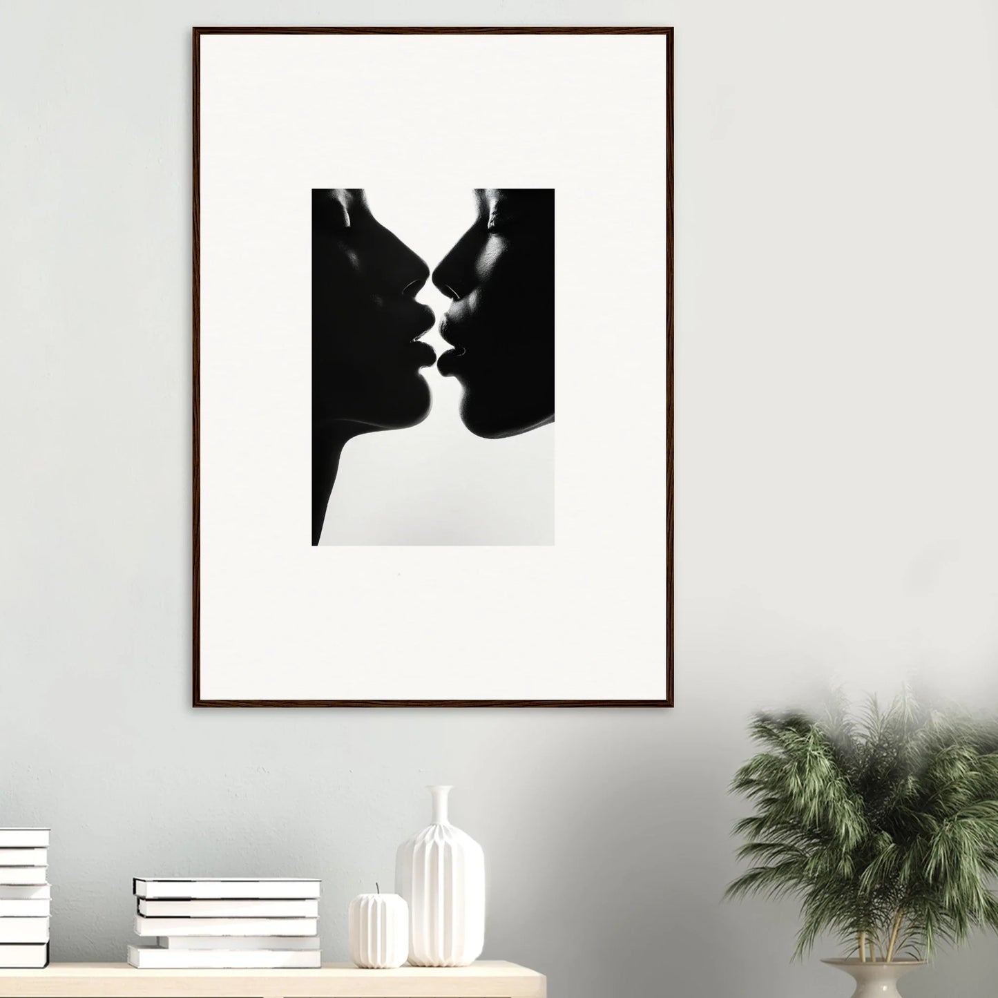 Black and white silhouette of two profiles nearly kissing for Luminous Midnight Kiss art