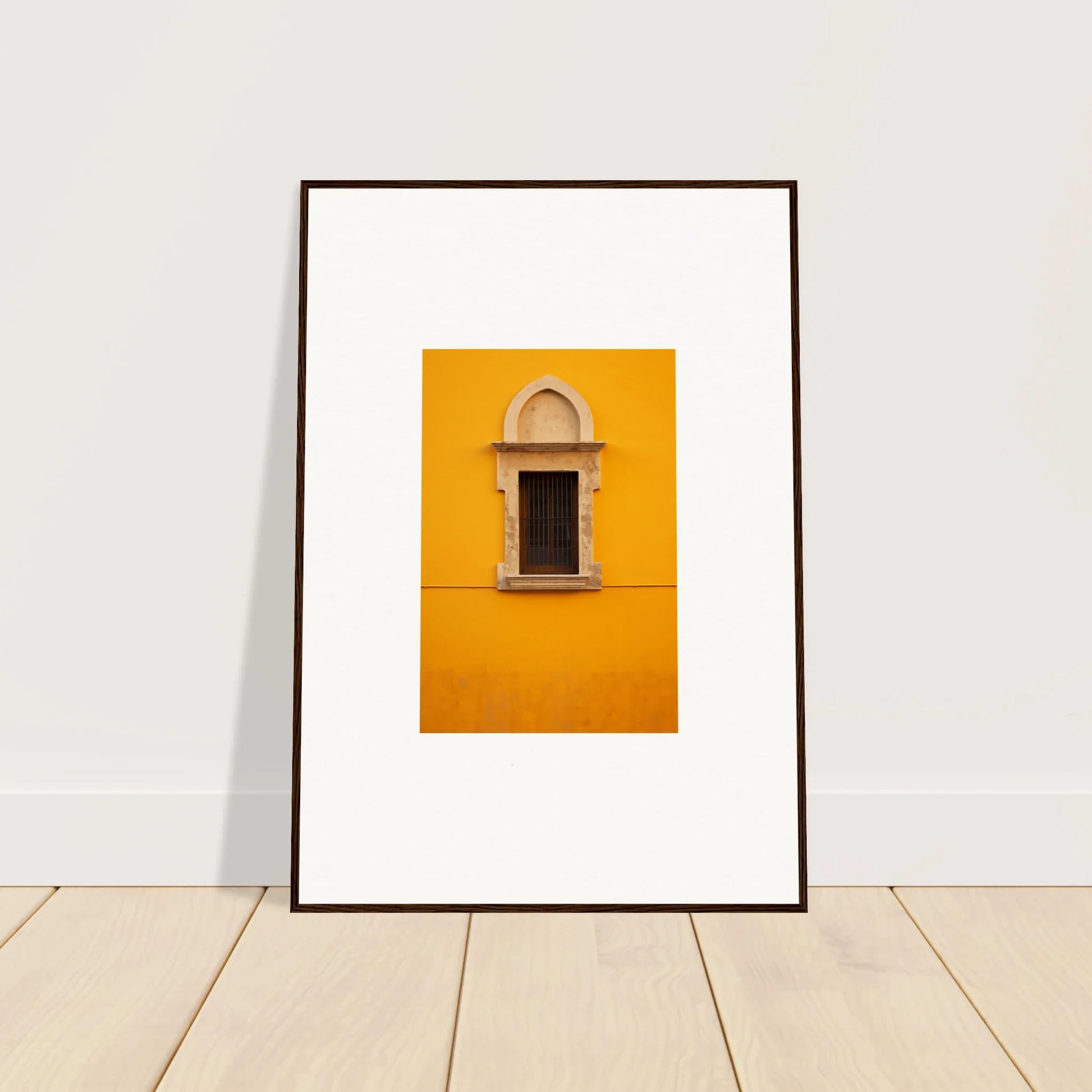 Framed wall art of an ornate window on a yellow wall in the Golden Correspondence Portal