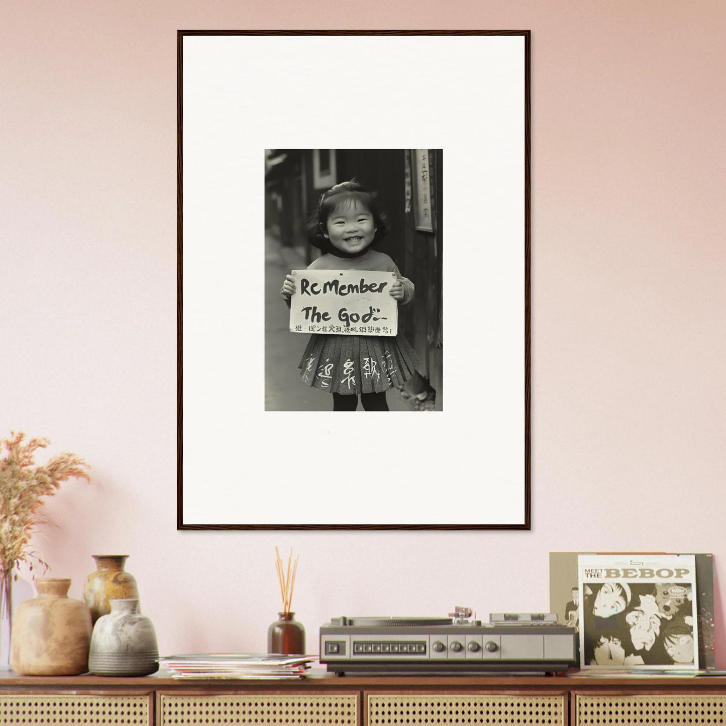 Framed black and white photo of a kid with Remember The Goal sign in Sacred Smile Echoes