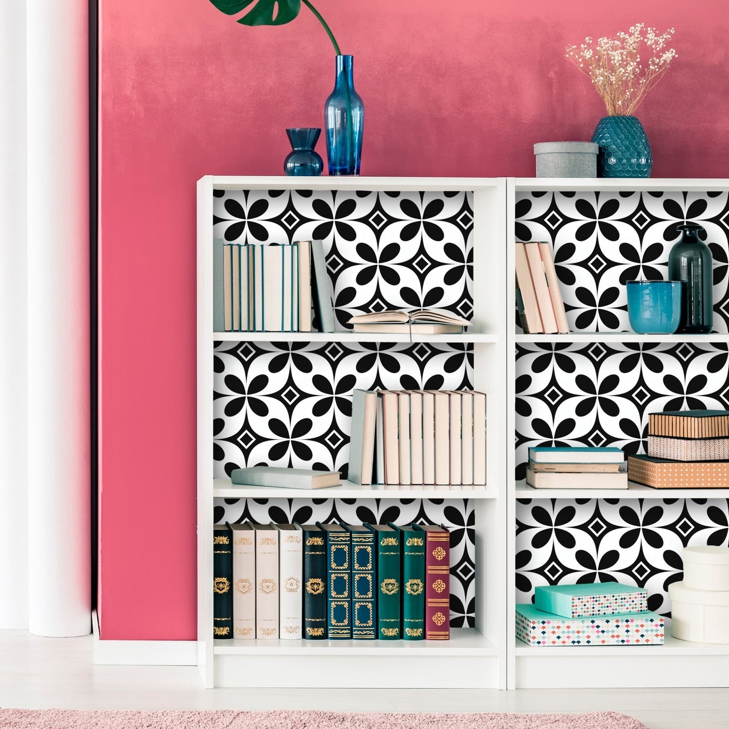 A white bookcase with black and white tiles on it